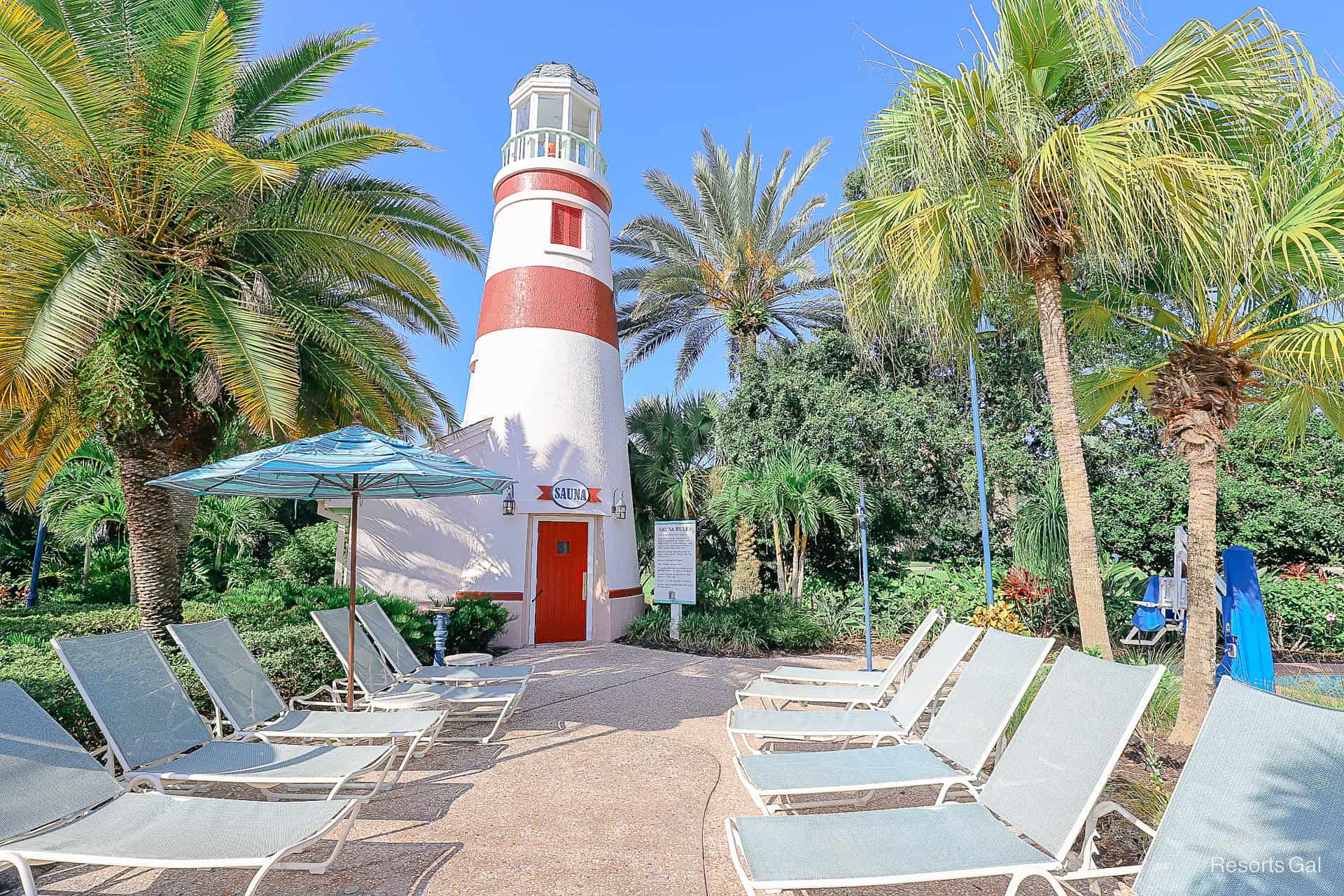 a red and white lighthouse that has a sauna room inside of it