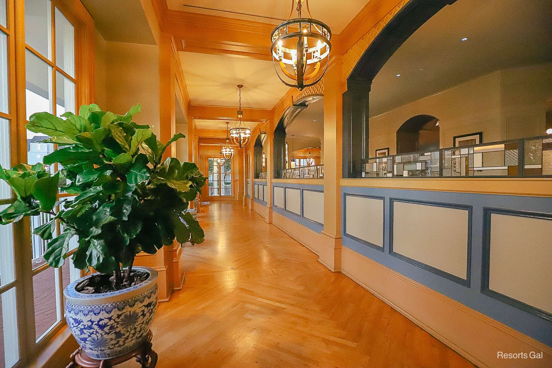 a long hallway that runs alongside the lobby restaurant 