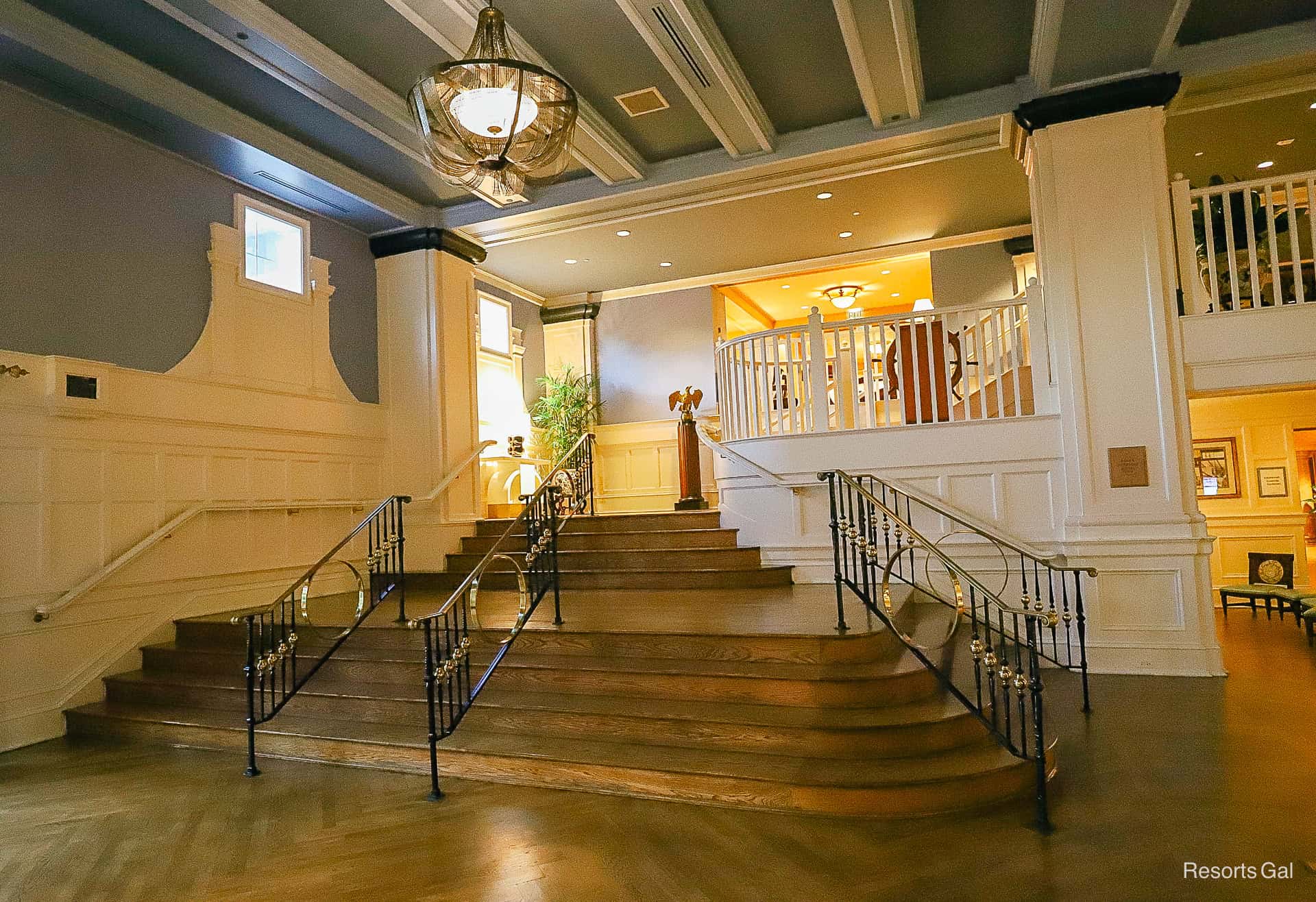 stairs leading to the second floor with decorative iron railings 