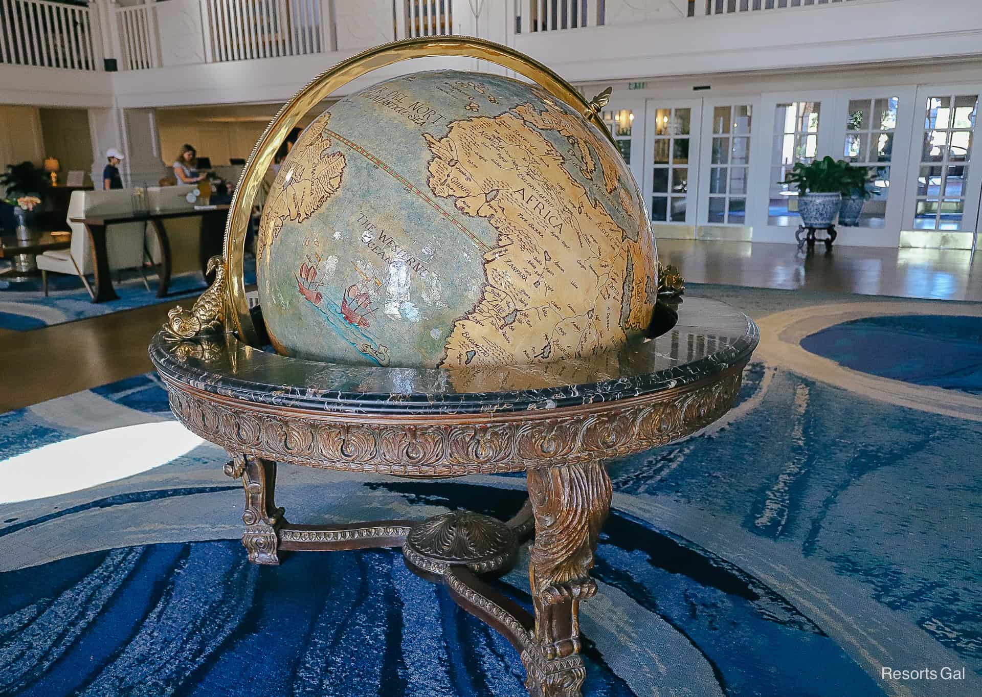 a large globe that sits in the center of the lobby 