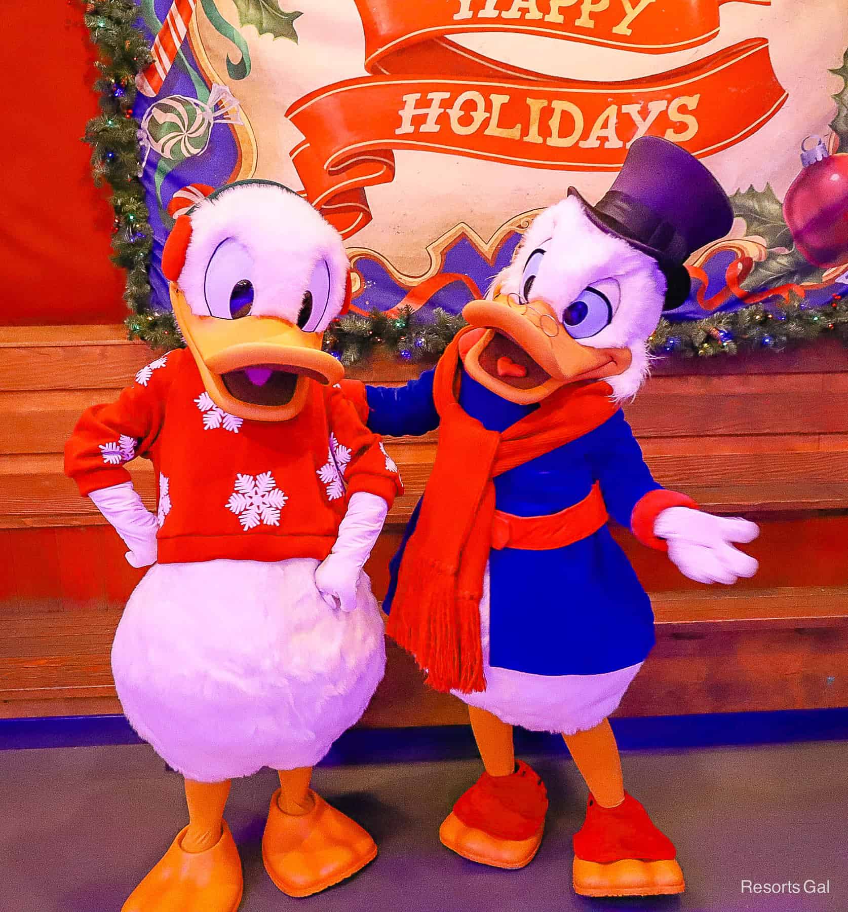 Donald wears a red Christmas sweater with white snowflakes 