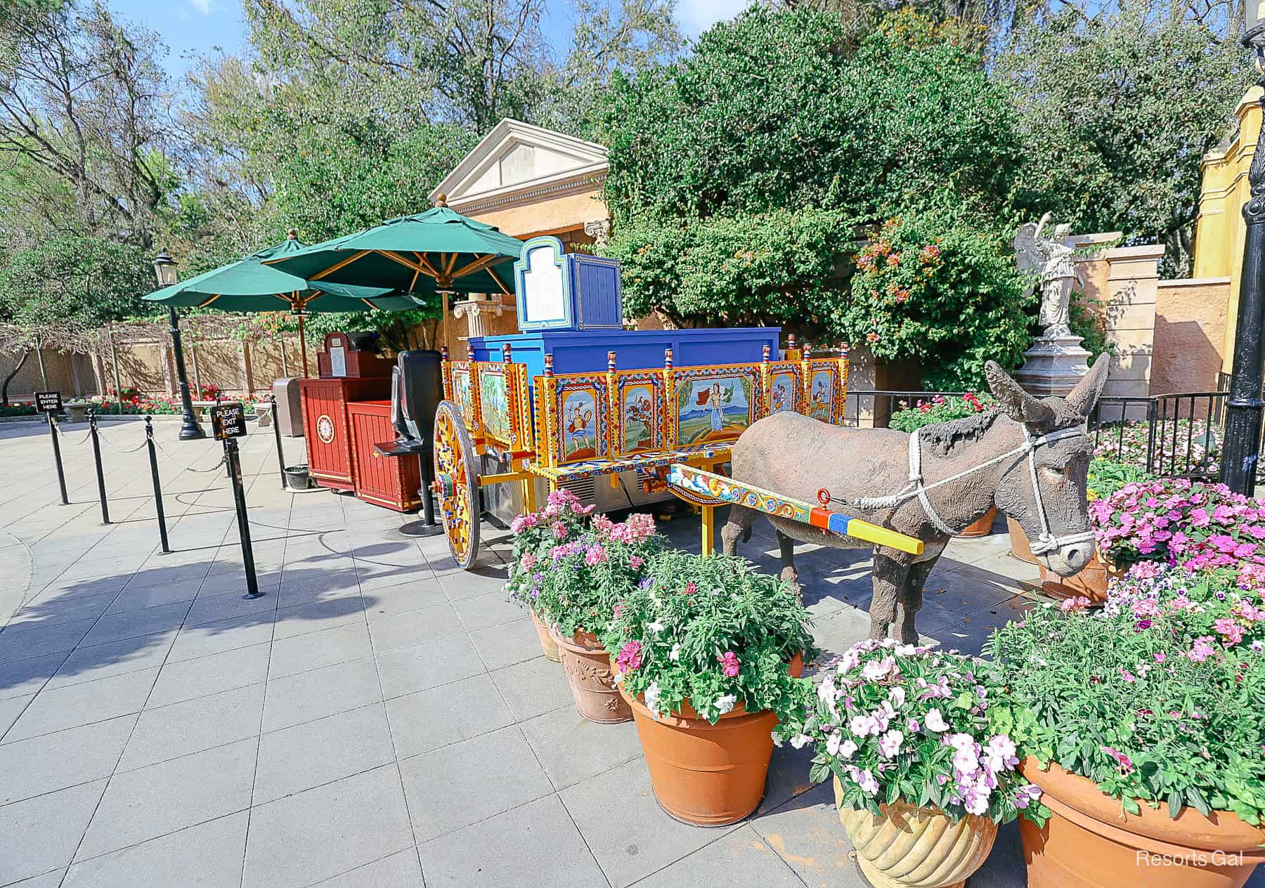 beverage cart with a faux donkey or mule and potted plants 