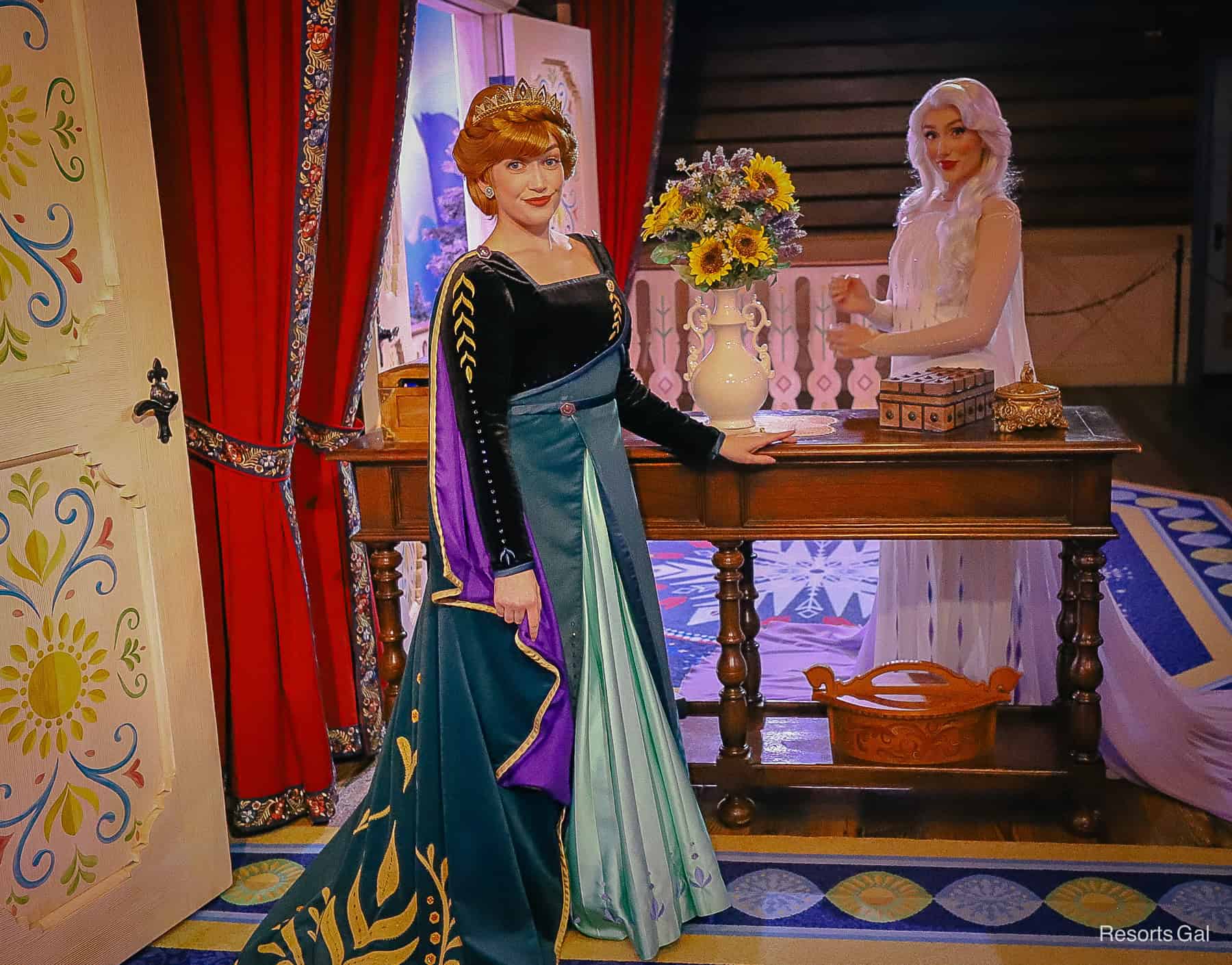 Anna and Elsa pose for a photo at their Royal Sommerhus. 