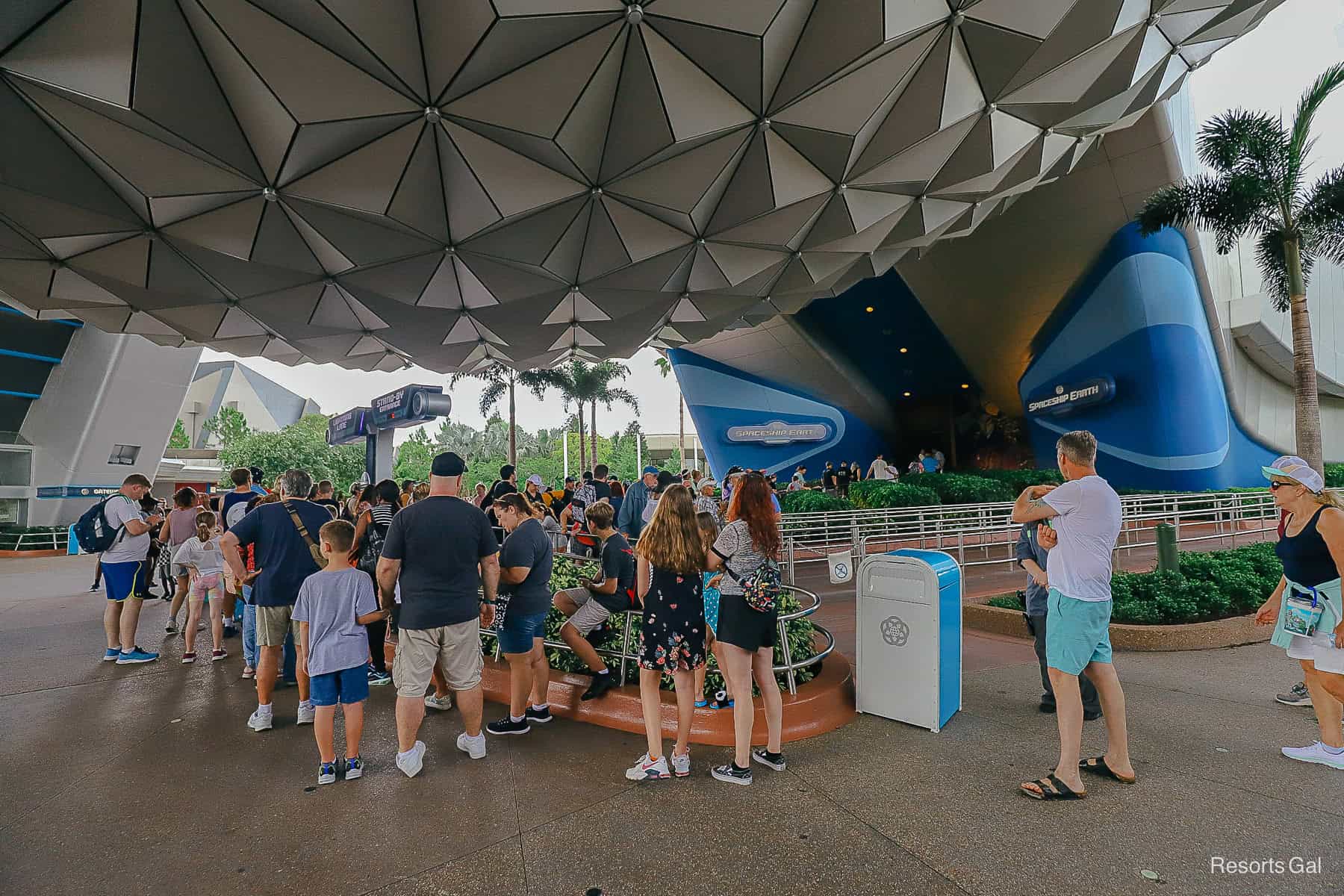 a line of guests waiting to ride Spaceship Earth 