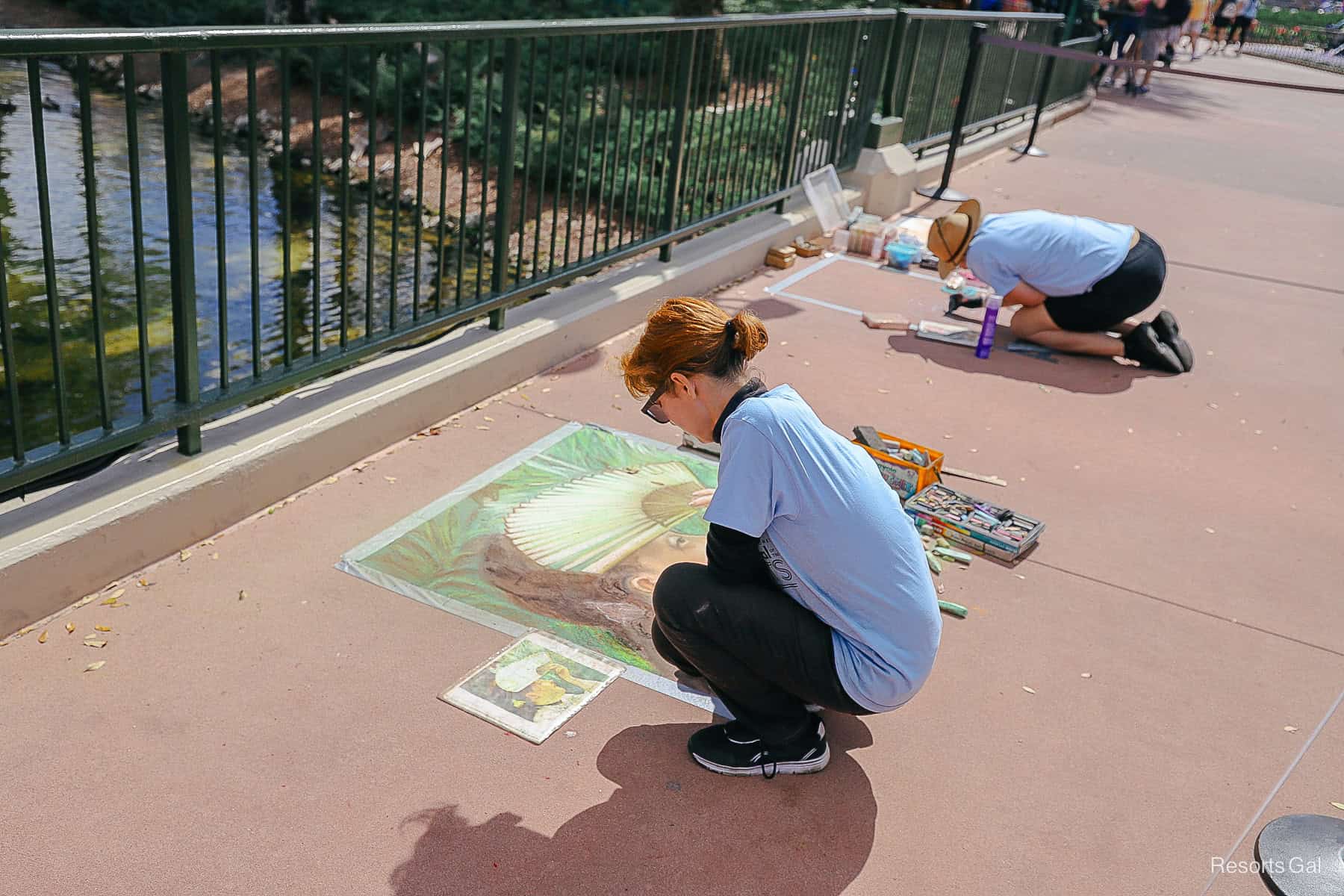 live artists creating chalk drawings at Epcot Festival of the Holidays 