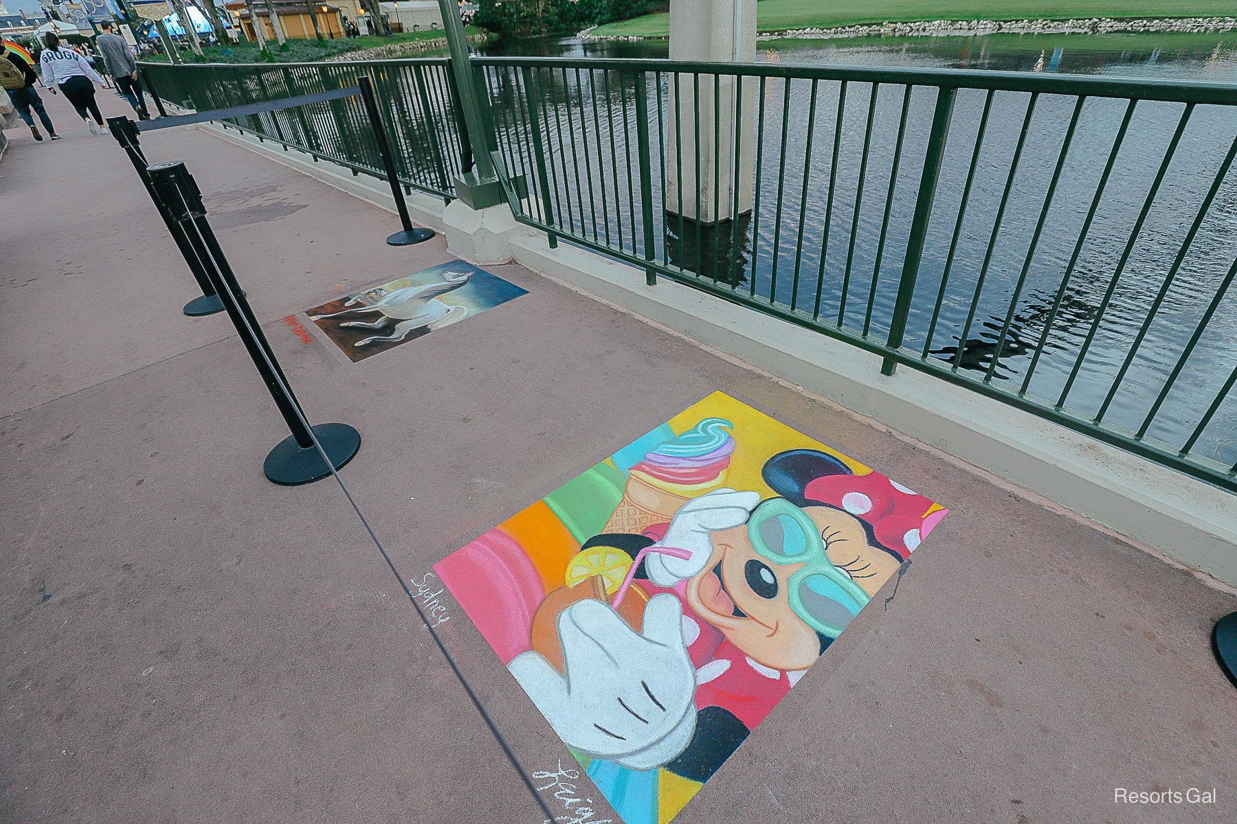 chalk art with Minnie Mouse and a rainbow swirl  ice cream cone 