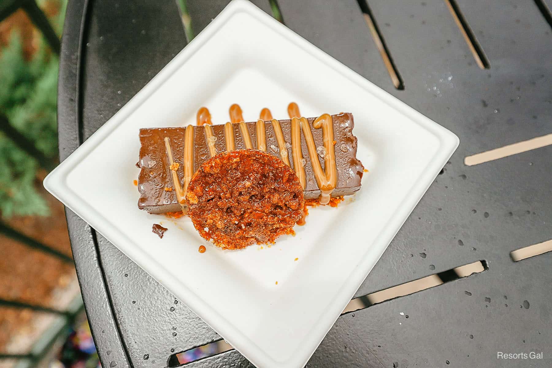 a chocolate bar with a chip and caramel sauce from an Epcot Festival 