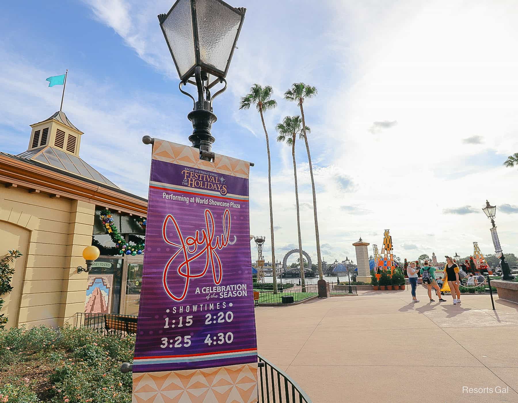 a sign with the times for Joyful at Epcot's Festival of the Holidays 