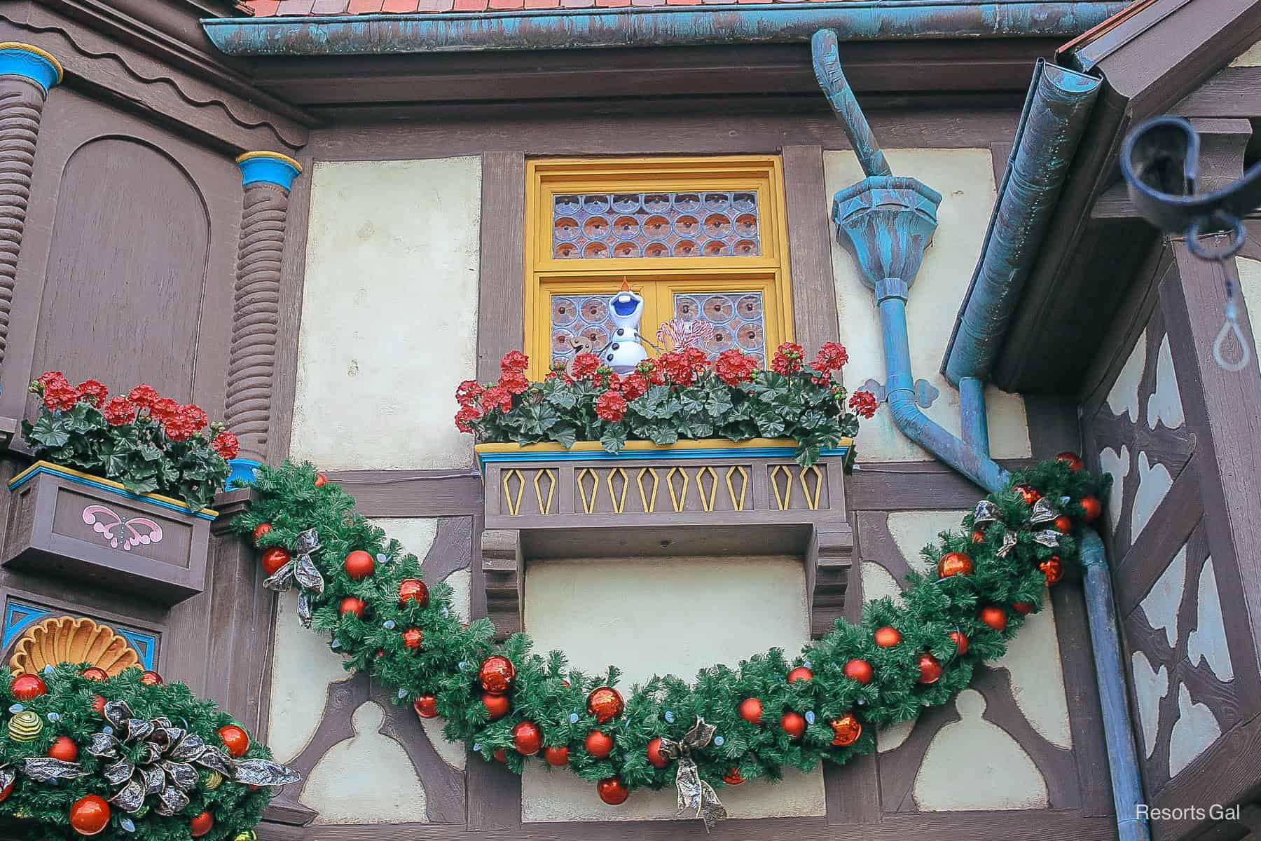 Olaf hiding in a window box in the 
Germany Pavilion as part of the scavenger hunt during the Festival of the Holidays 