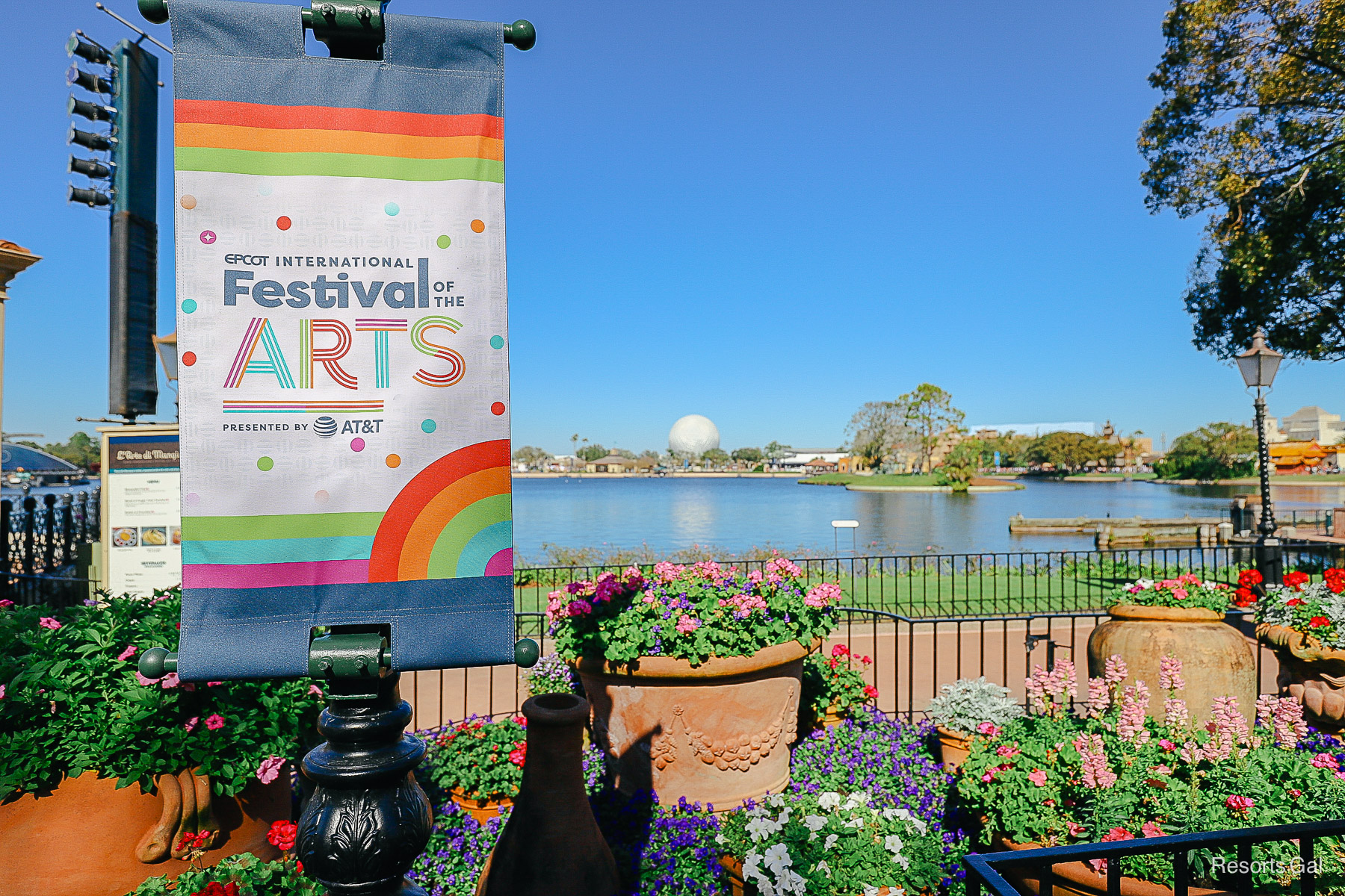 Epcot International Festival of the Arts signage with Spaceship Earth background 