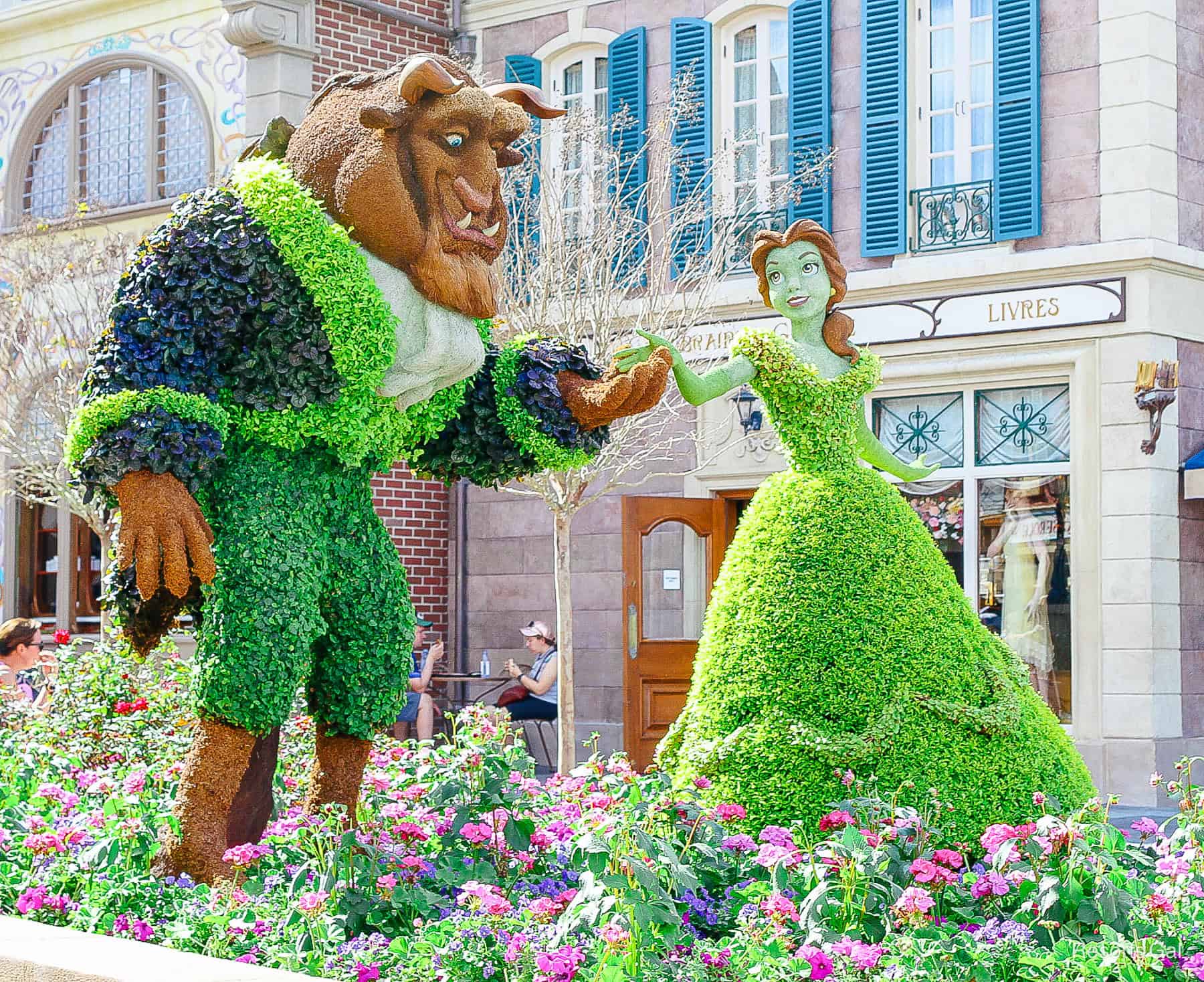 a topiary attraction of Beauty and the Beast during an Epcot Festival 