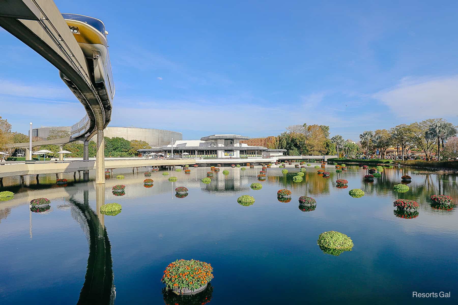 a scenic photo of the monorail passing through Epcot during the Flower and Garden Festival 