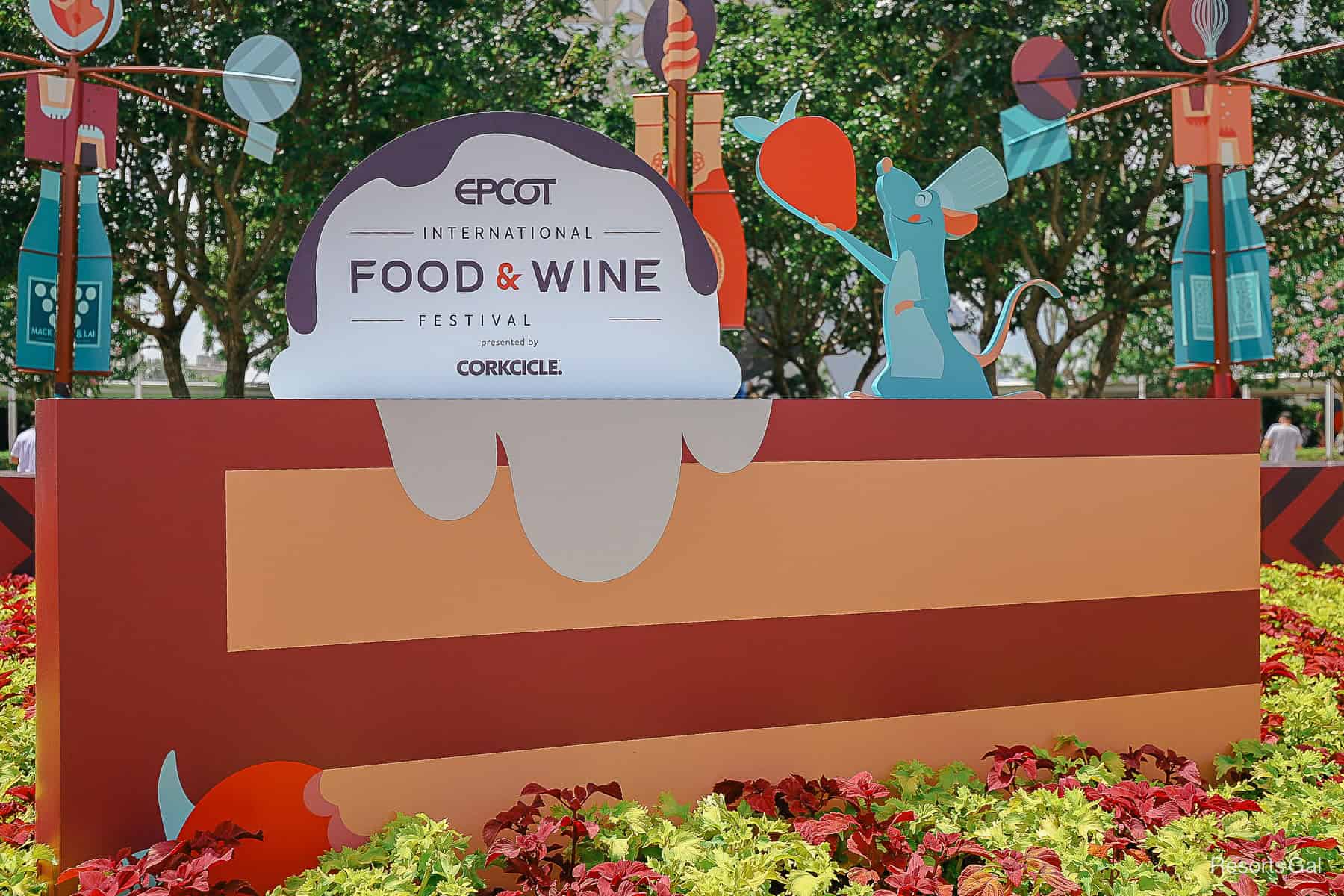 Epcot Food and Wine Festival Theming featuring Remy from Rataouille and a cardboard chocolate cake cut out 