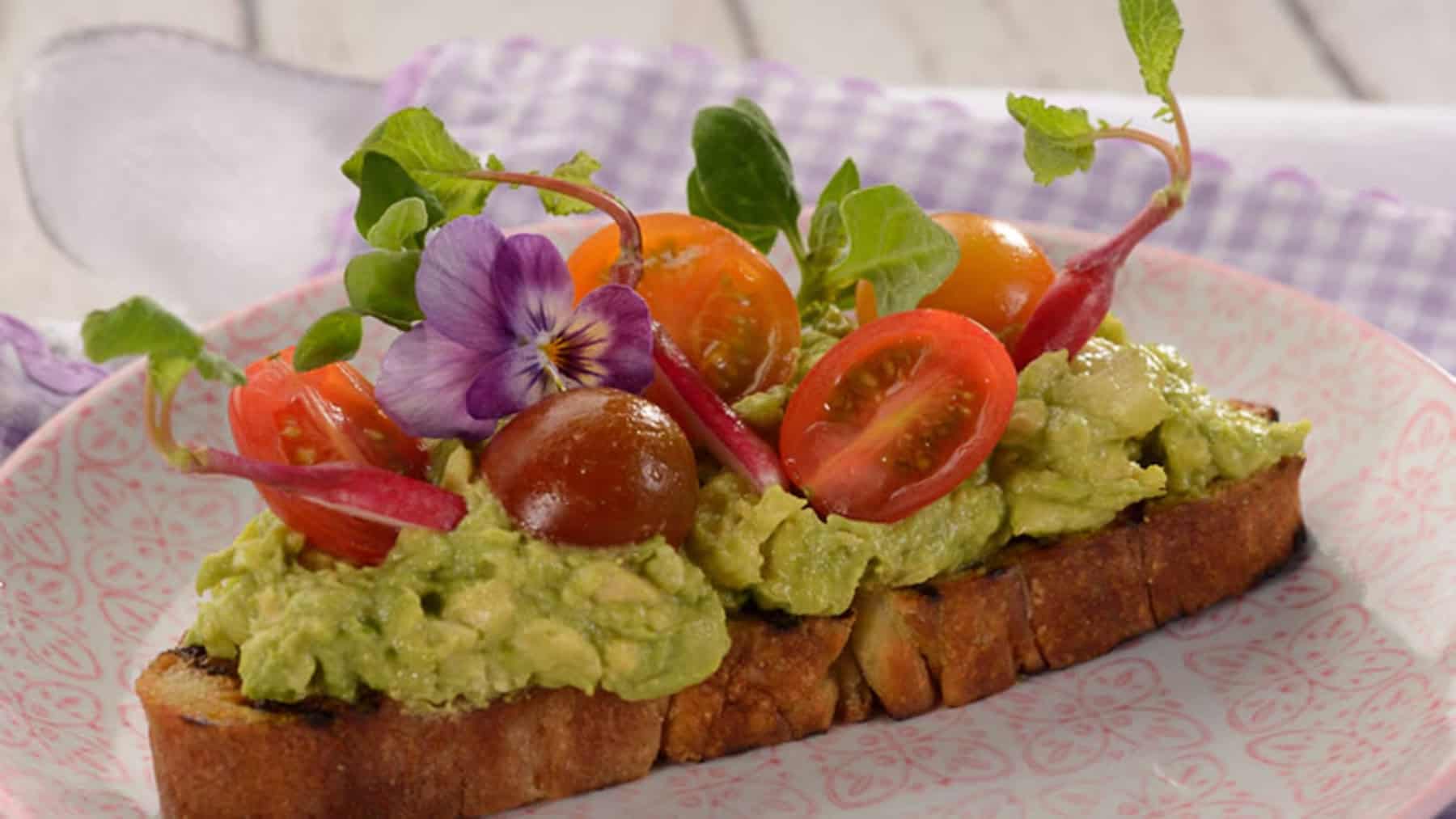 avocado toast on ciabatta bread with tiny tomatoes 