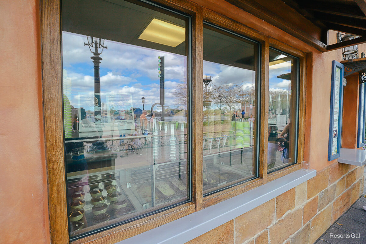 the window with gelato selections, cups, and cones 