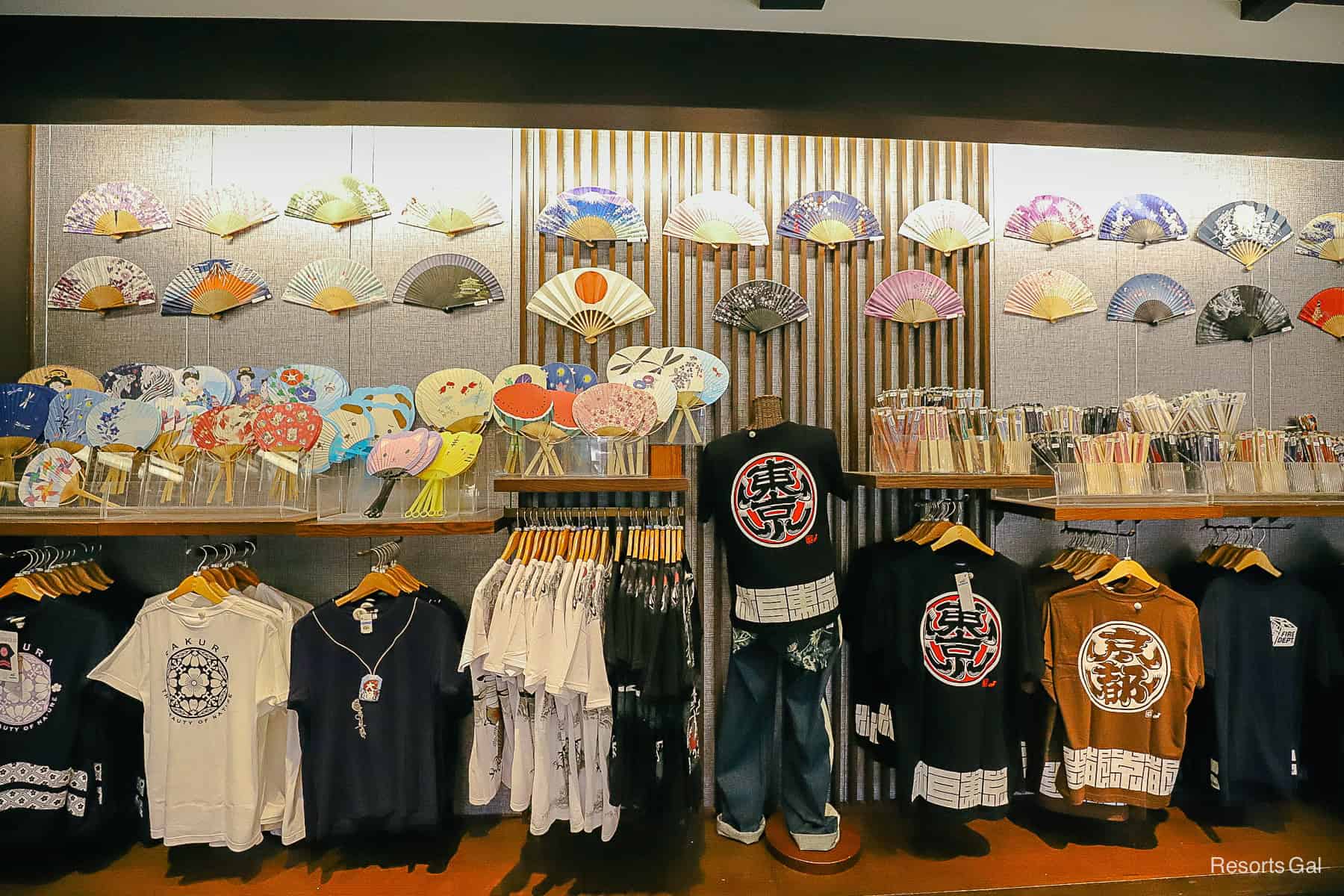 a display wall with Japanese fans and apparel 