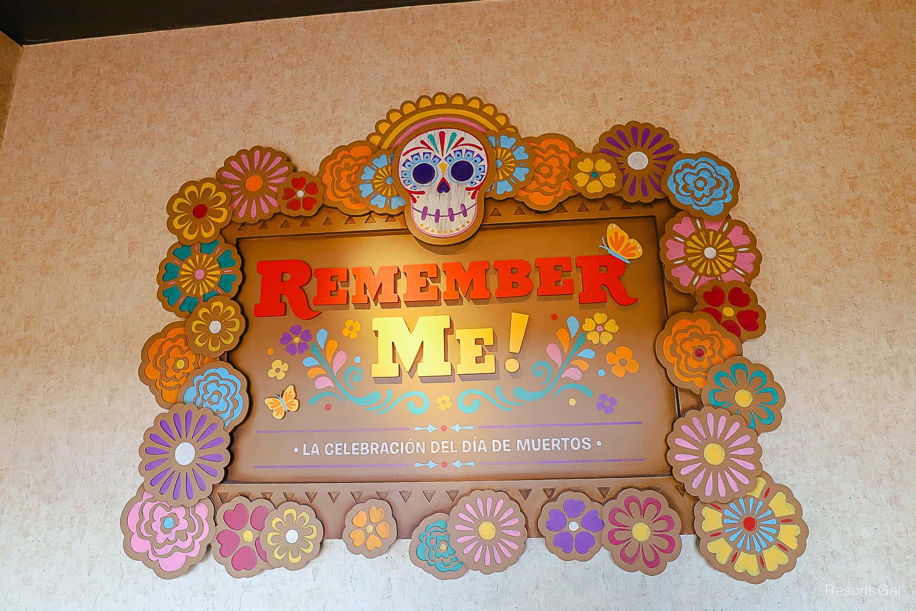 the attraction sign says Remember Me! La Celebracion Del Dia De Muertos 