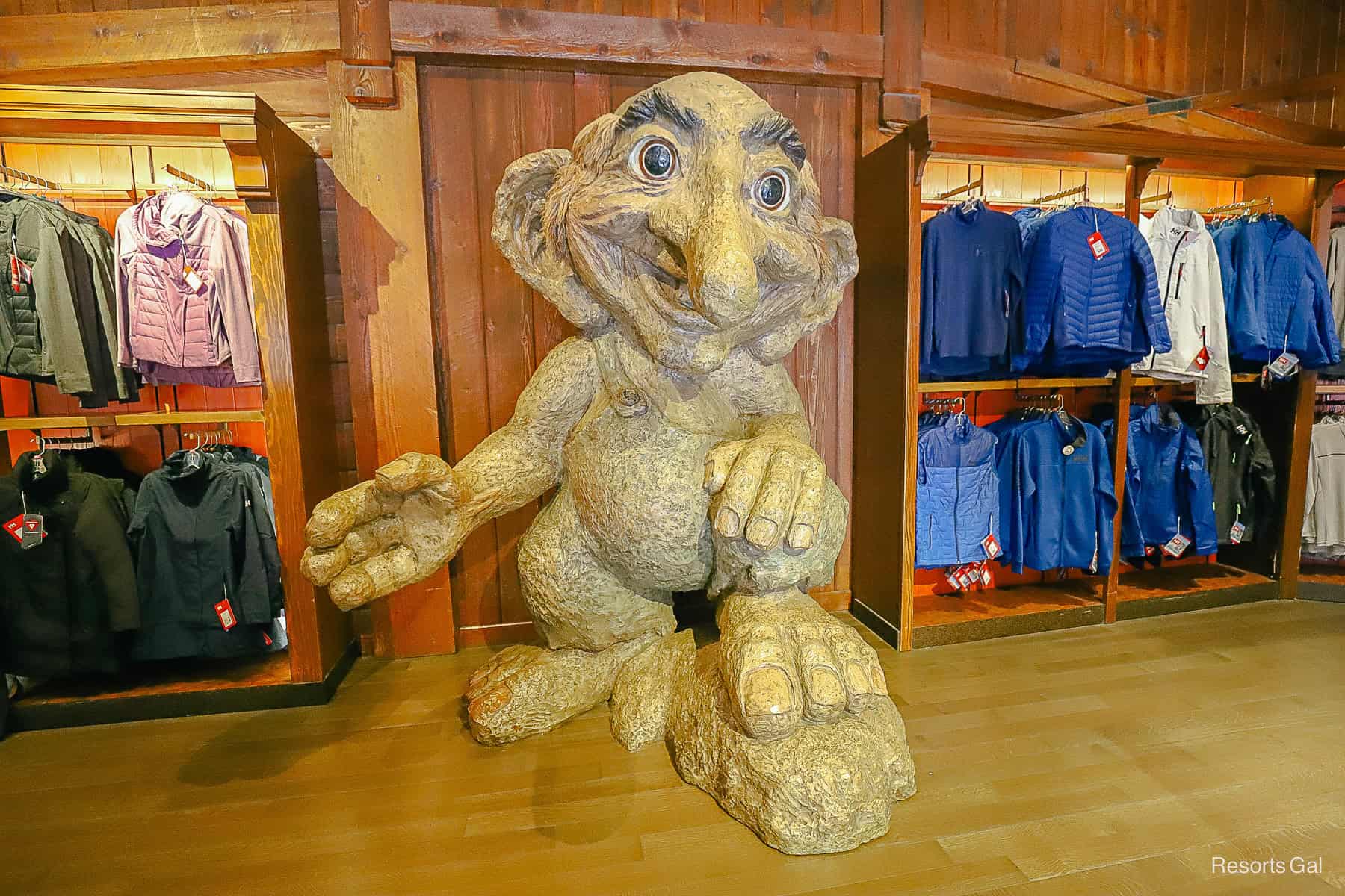 a giant statue of a troll in the Puffins Roost at Epcot 