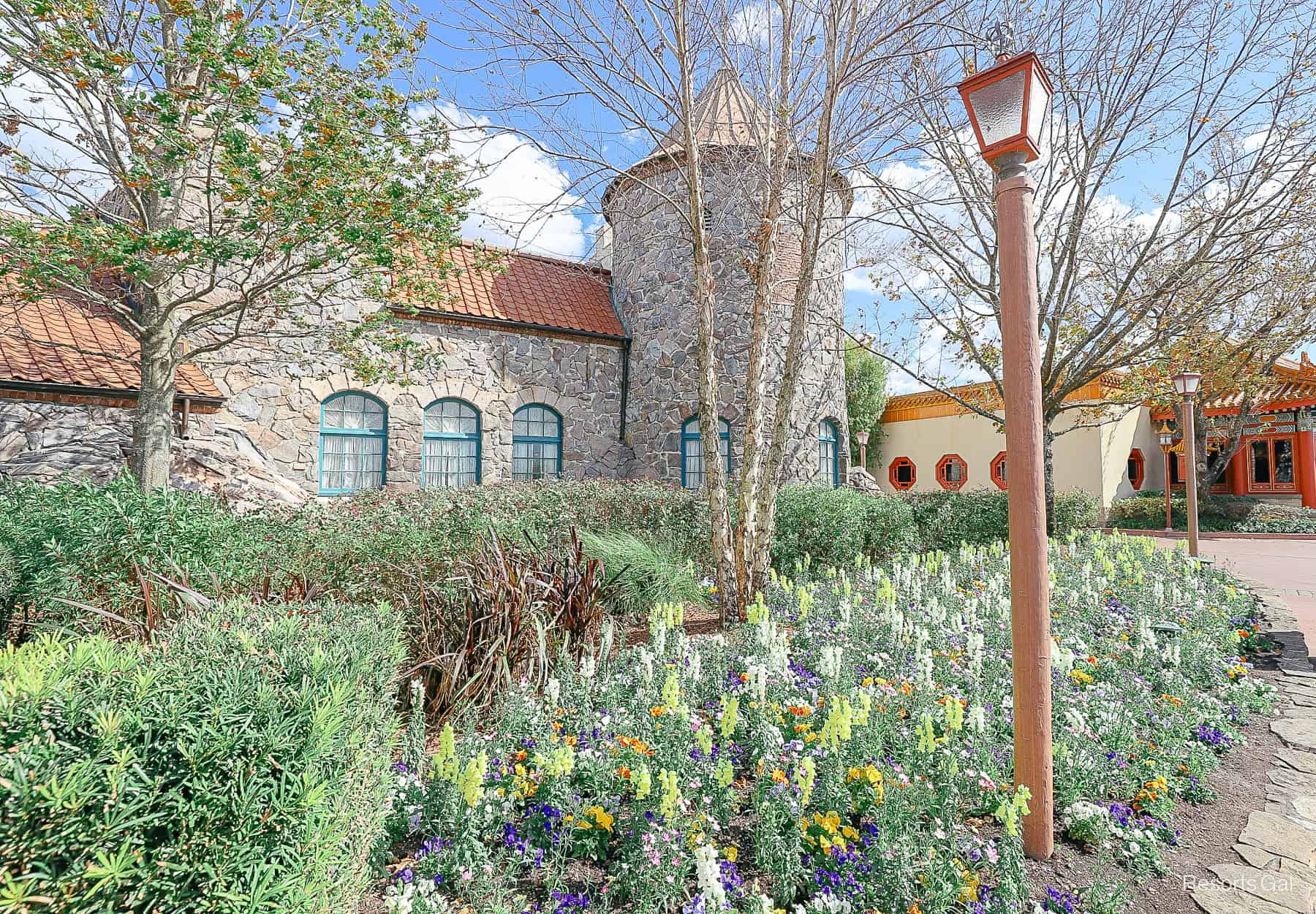 the Norway Pavilion with spring flowers in bloom at Epcot 