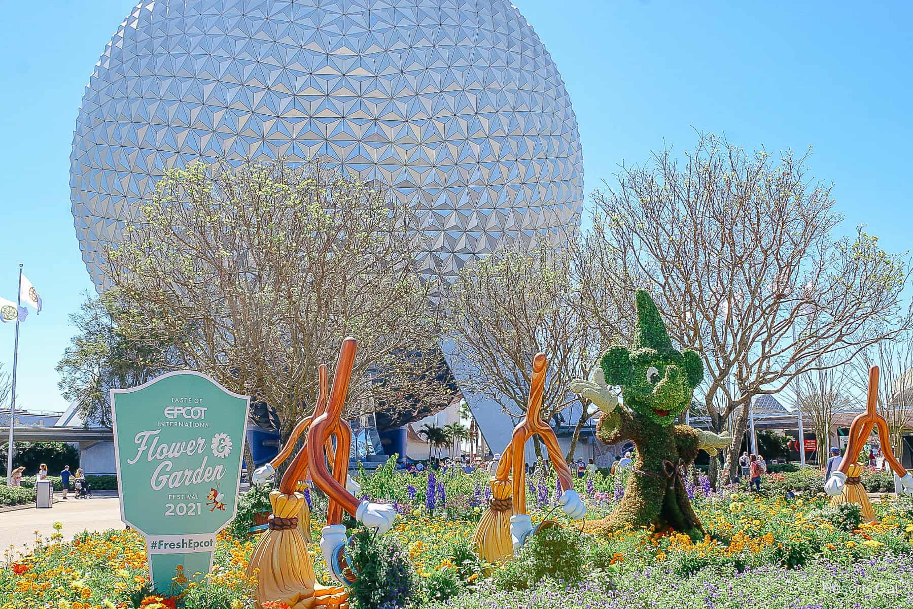 Sorcerer Mickey greets guests in his miniature version topiary. 