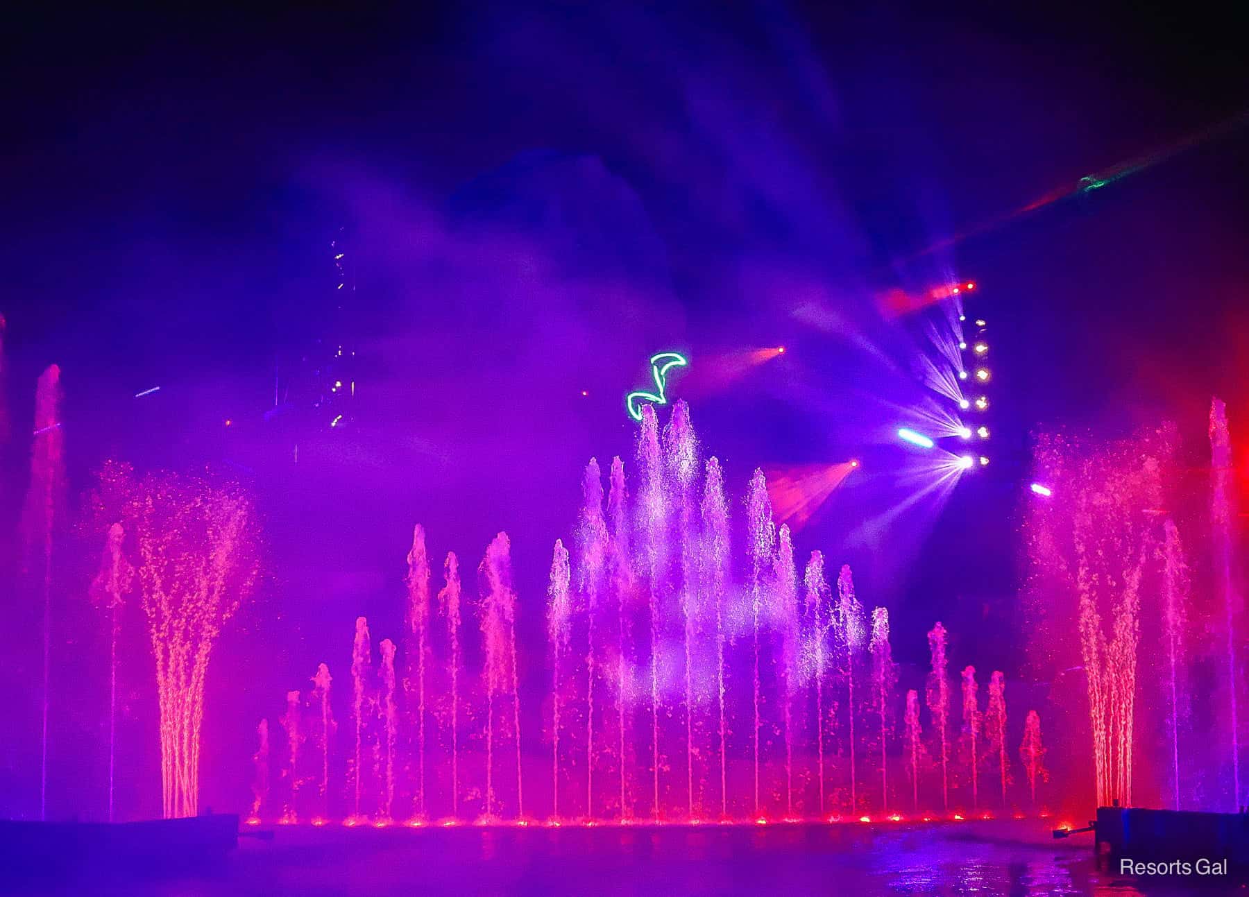 purple and hot pink water sprays fountains 