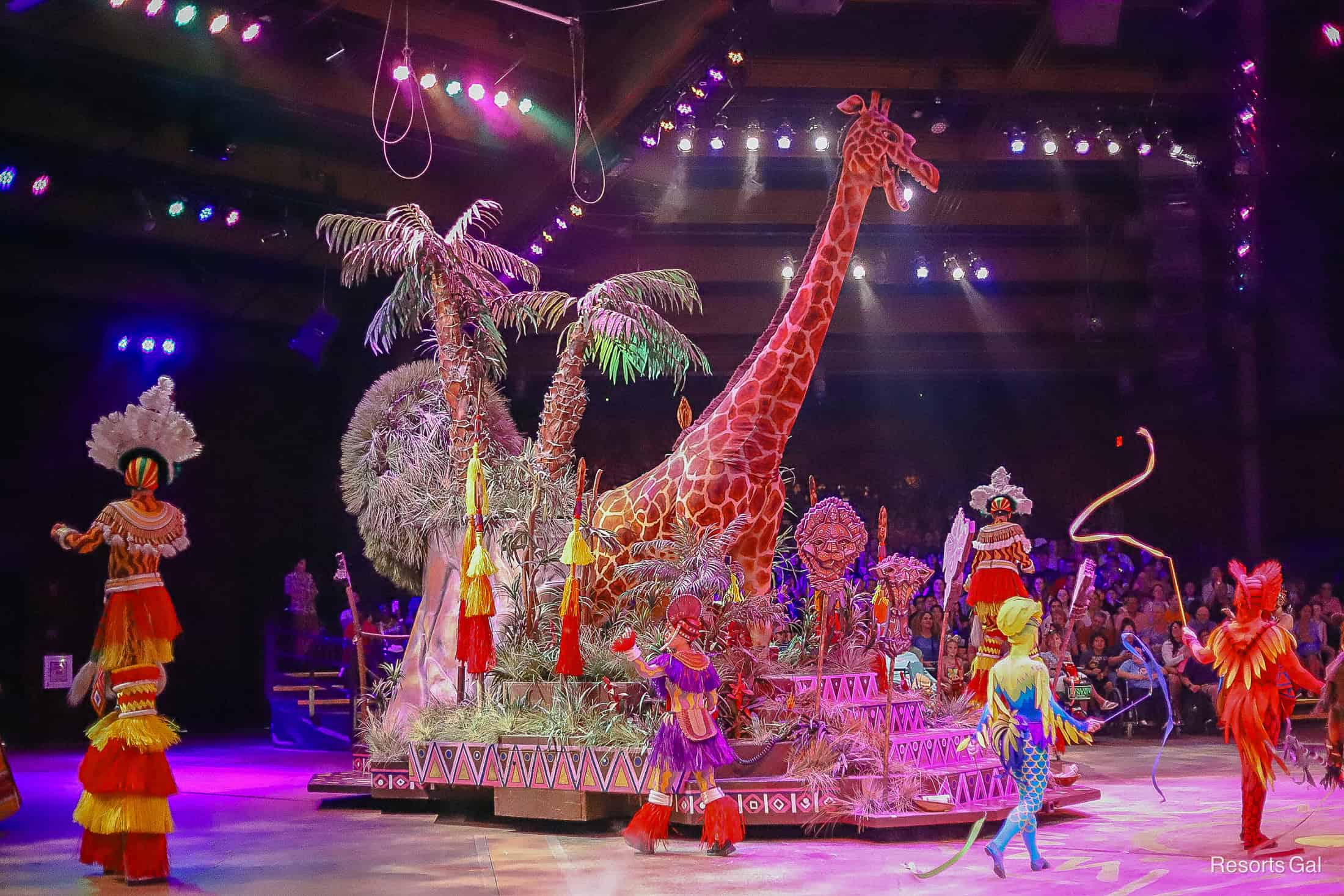 a large giraffe puppet represents one of the sections in Festival of the Lion King at Disney's Animal Kingdom. 