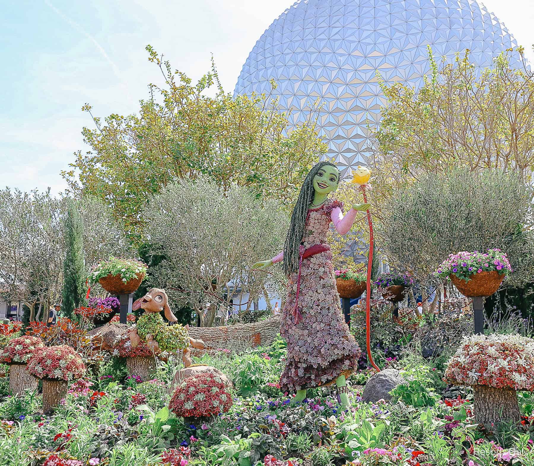 last year's Asha topiary at Epcot's Entrance from Disney's animated film 'Wish'