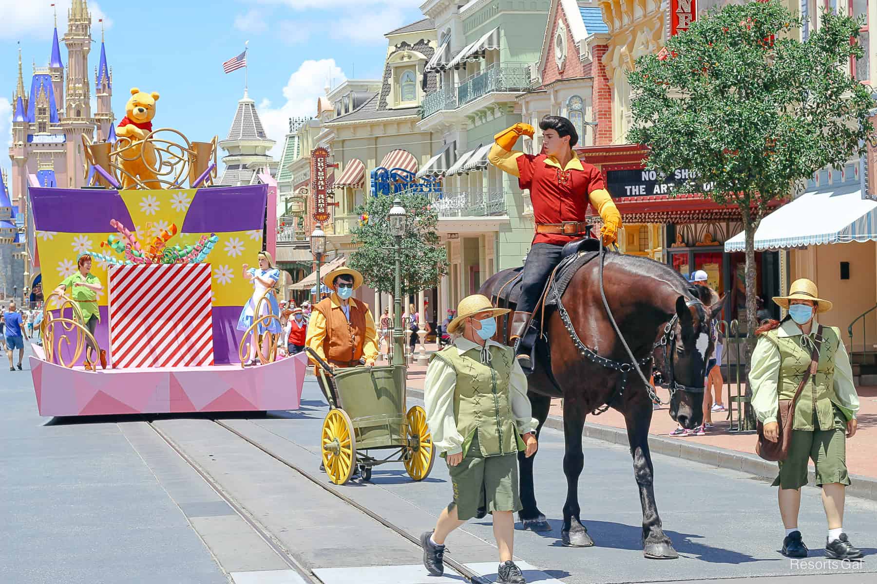 Gaston riding a horse down Main Street USA. 