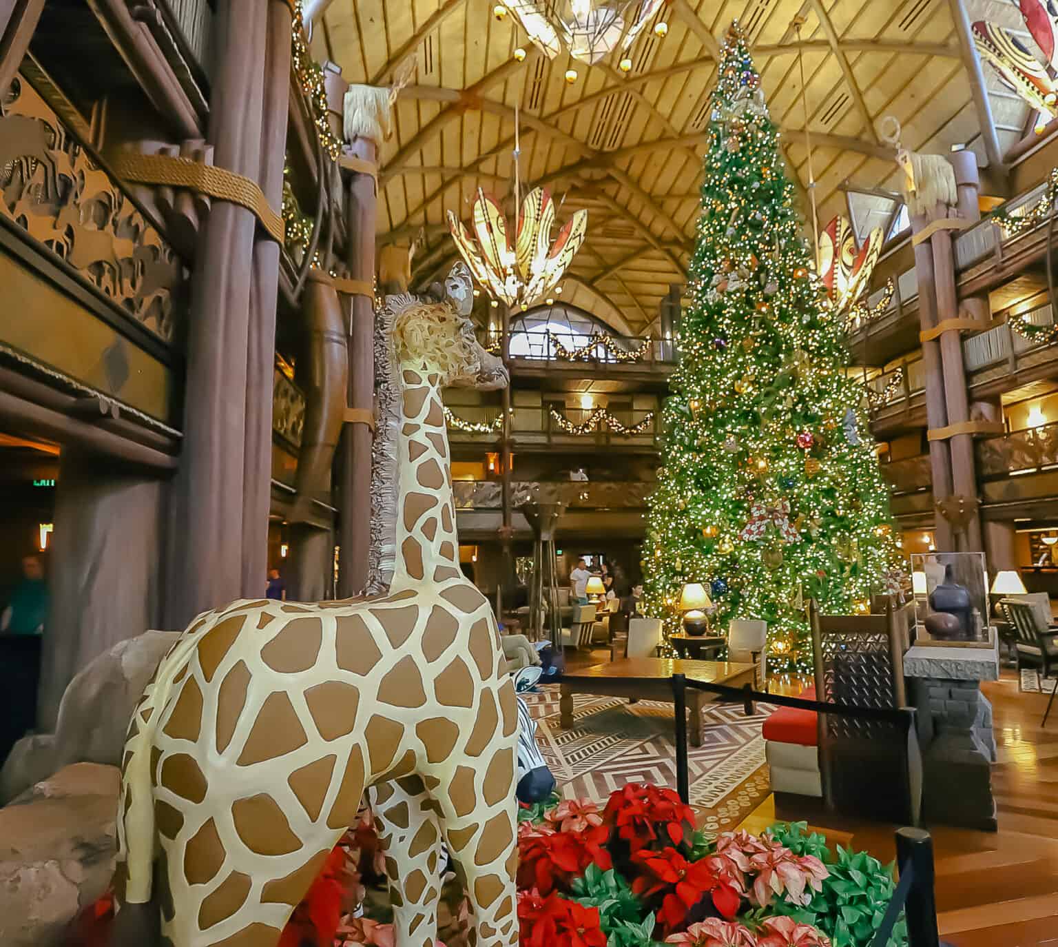 The gingerbread creations face the Christmas Tree at Disney's Animal Kingdom Lodge.