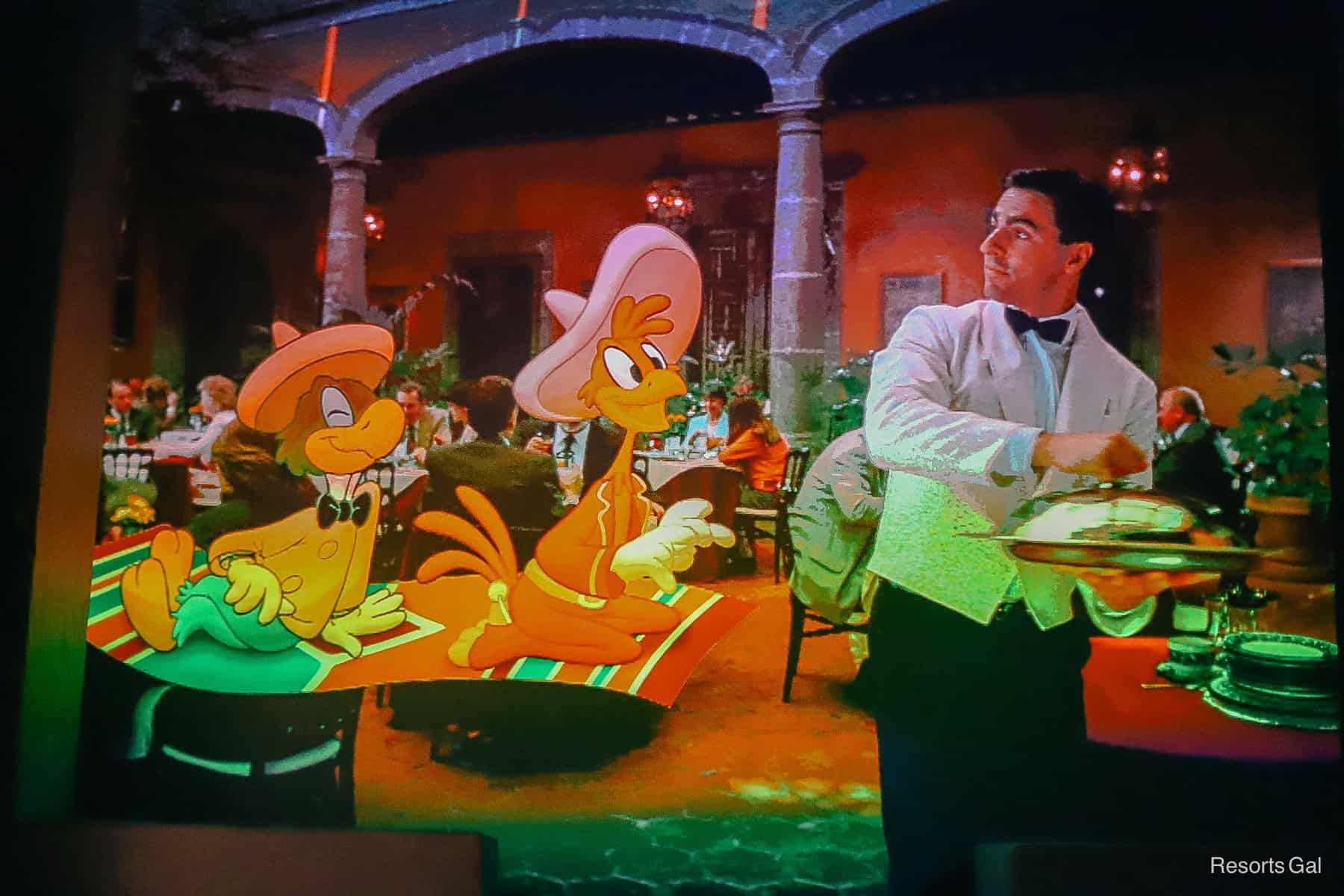 a ride scene with a chef and two of the three caballeros looking for Donald Duck 