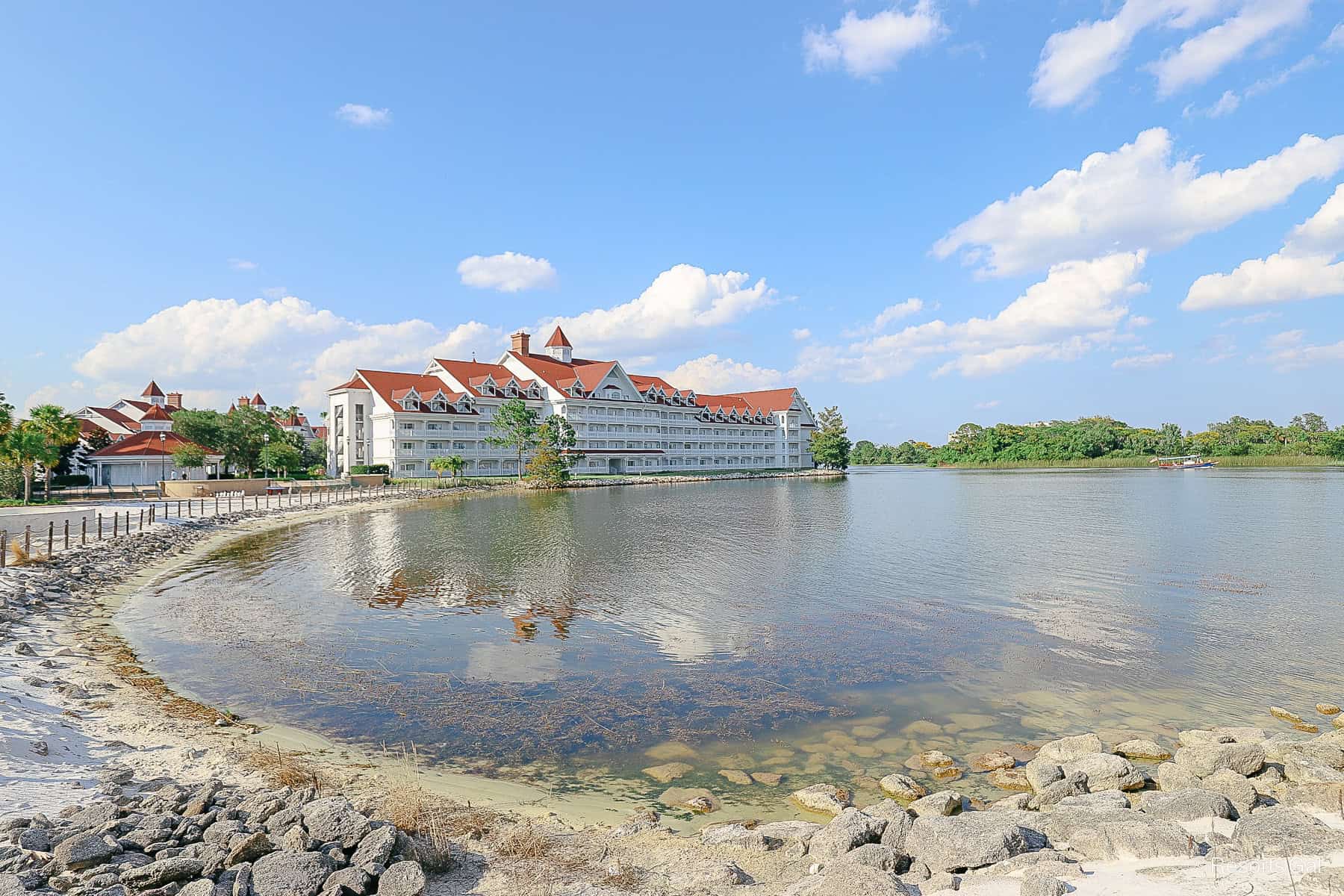 a picture of Grand Floridian sitting in the backdrop of Seven Seas Lagoon 