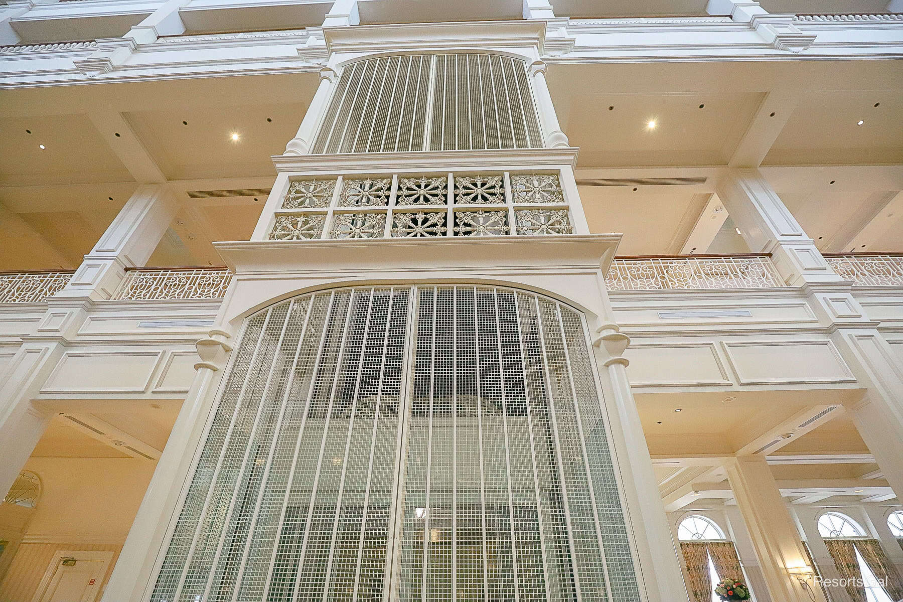 a closeup of the lobby elevator that looks like a bird cage 