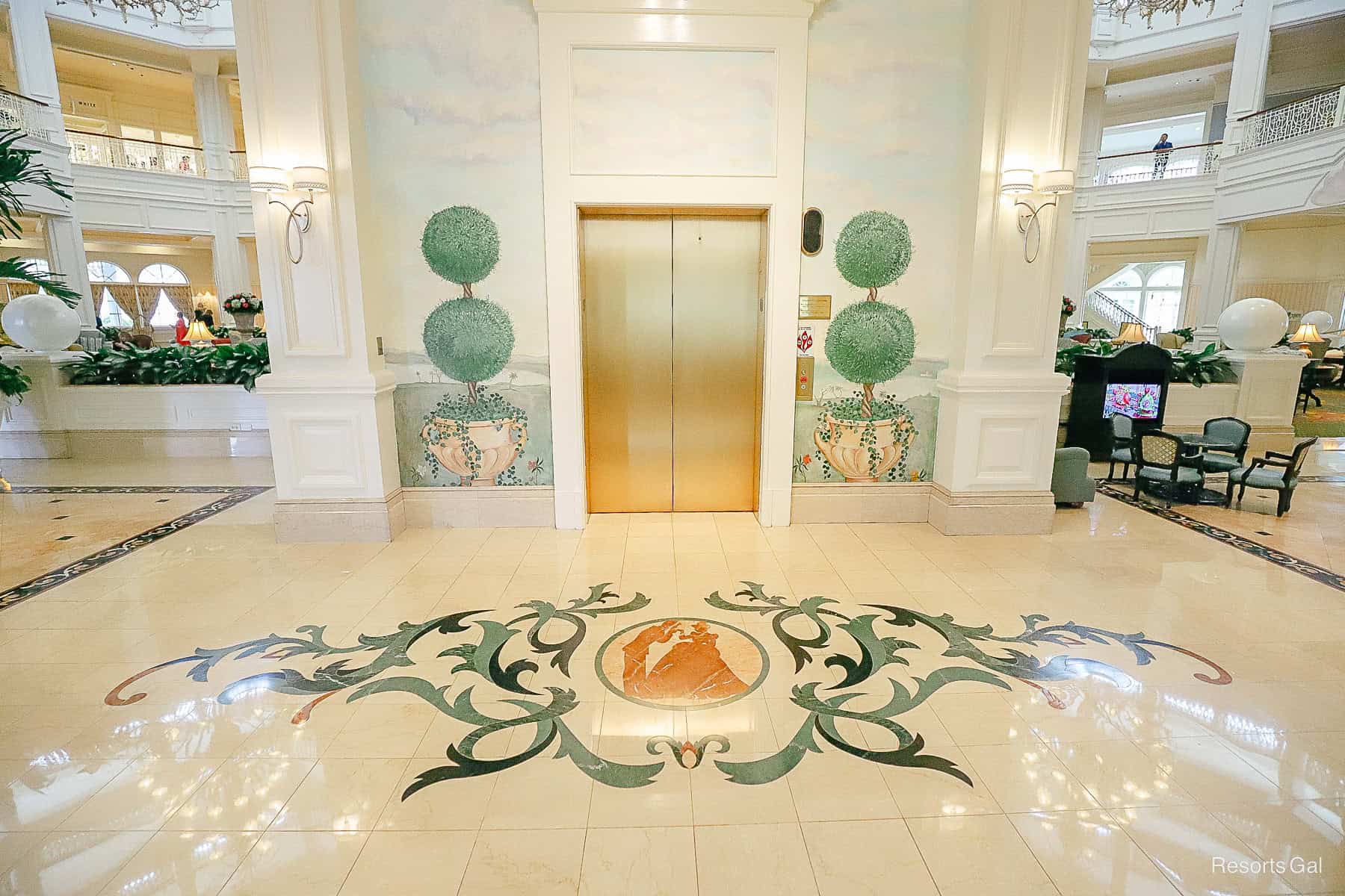 the elevator with topiary mural and Cinderella tile work 