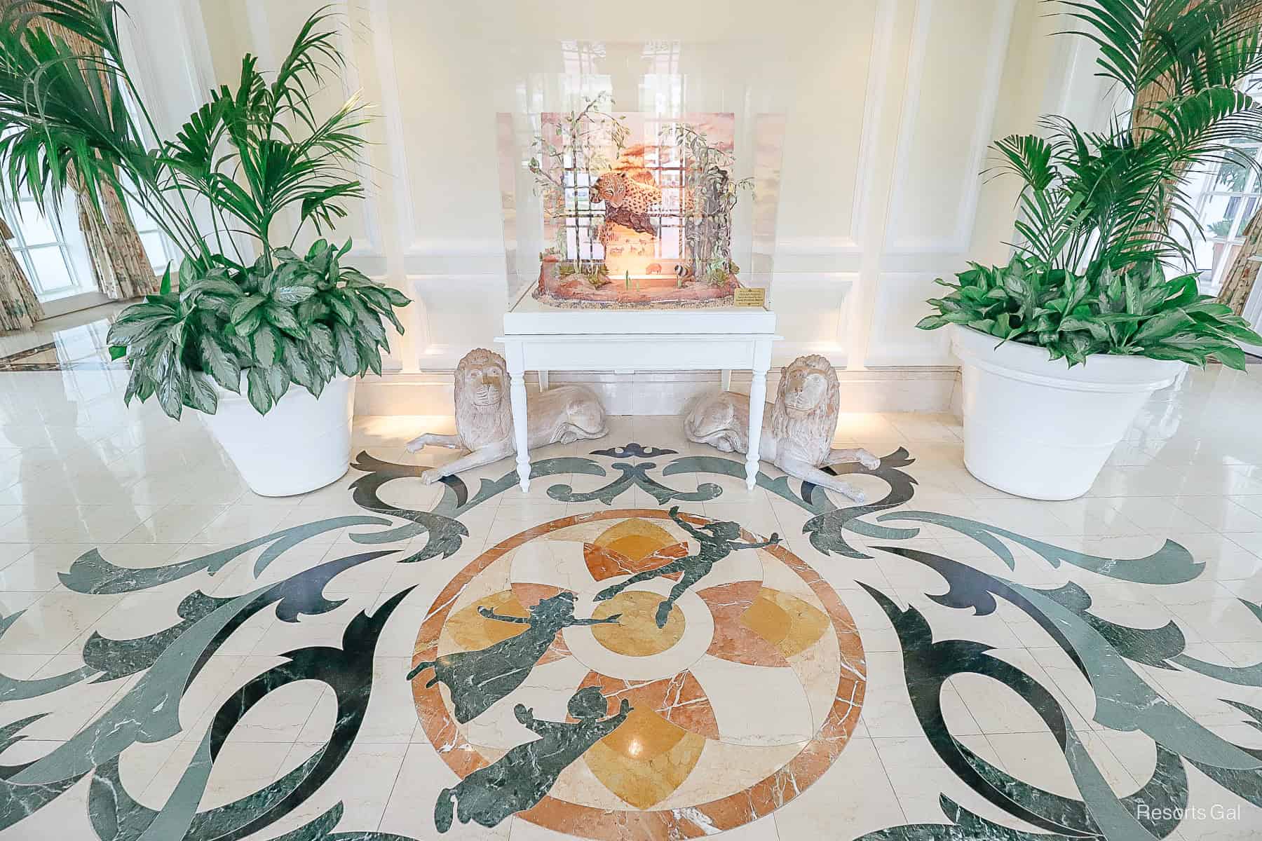 the Grand Floridian side entrance with Peter Pan, Wendy, Jon and Michael in the floor tile 