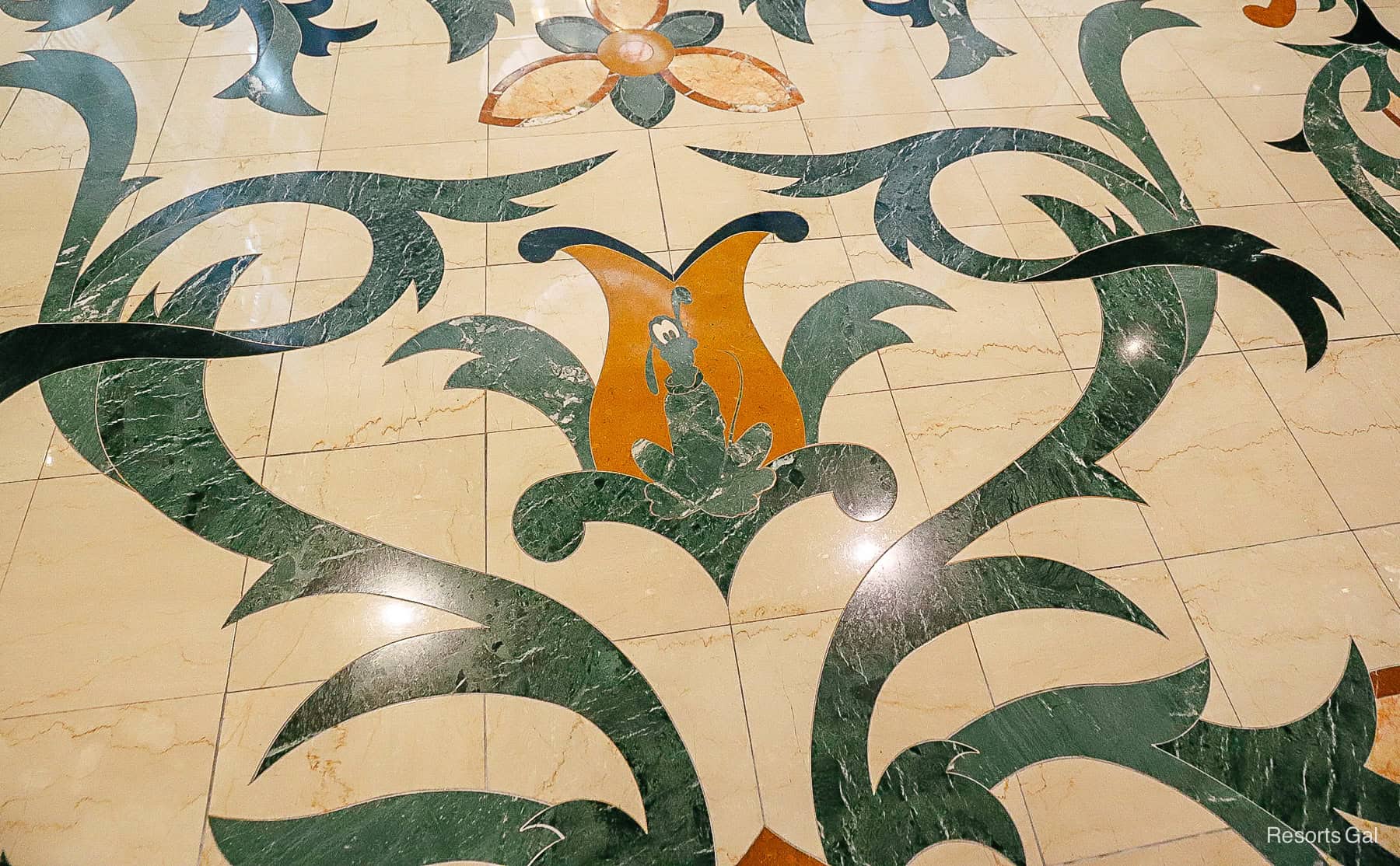 Pluto in marble flooring at the Grand Floridian lobby 