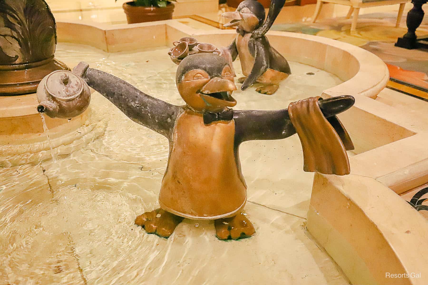 penguin fountain with widespread arms 