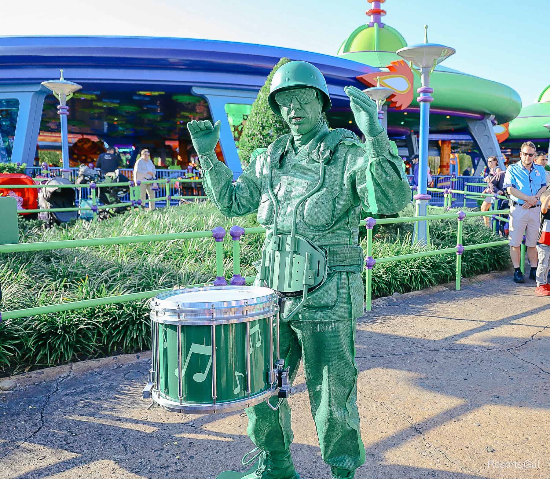 a Green army man playing the drums in Toy Story Land at Hollywood Studios 