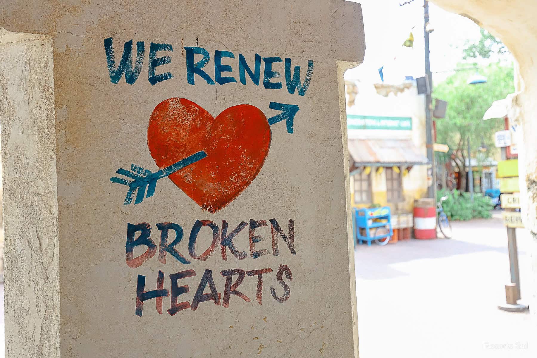 a closeup of the mural in Harambe Market that says We Renew Broken Hearts 
