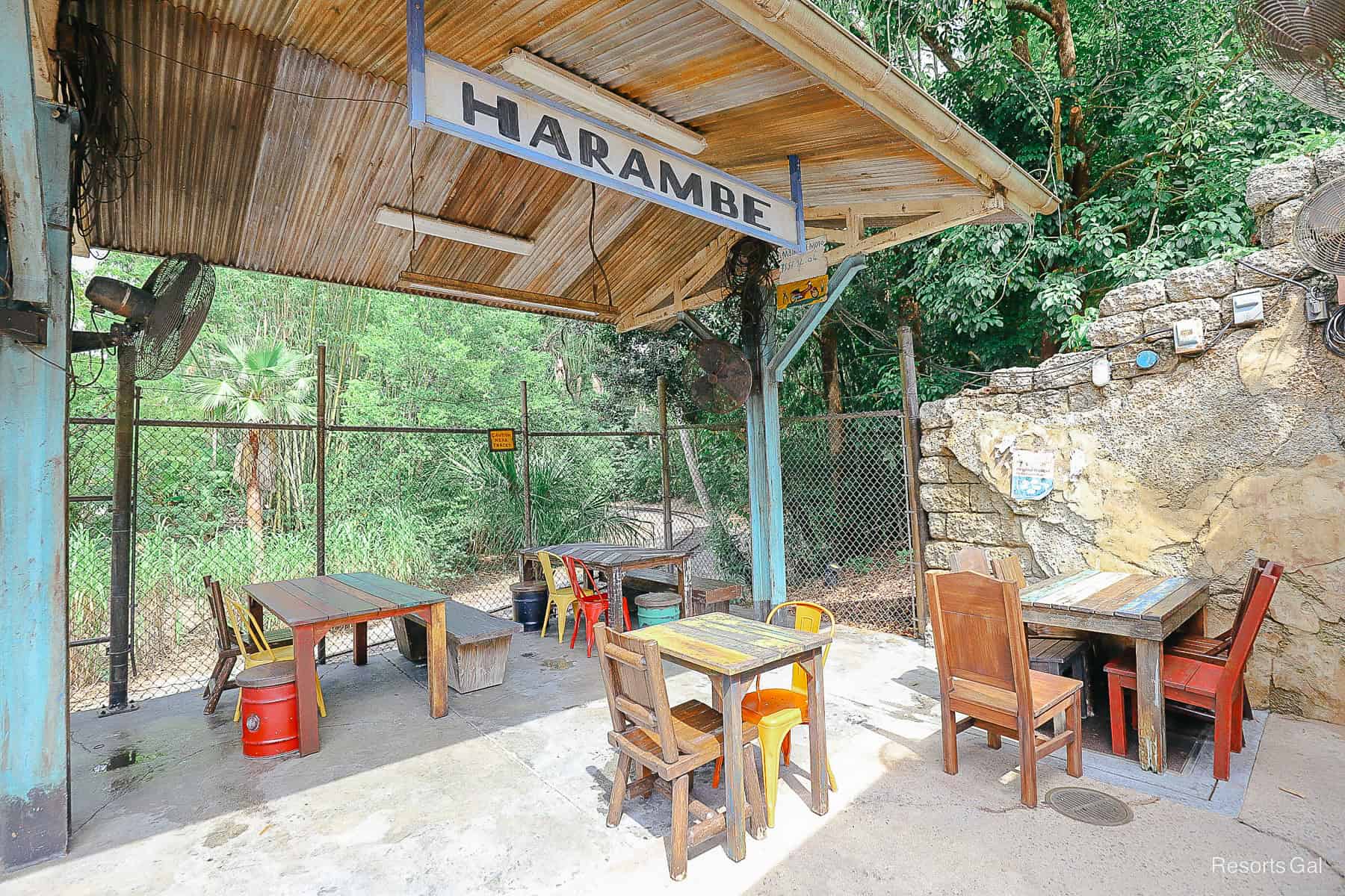 a Harambe Market dining area with tables and chairs 