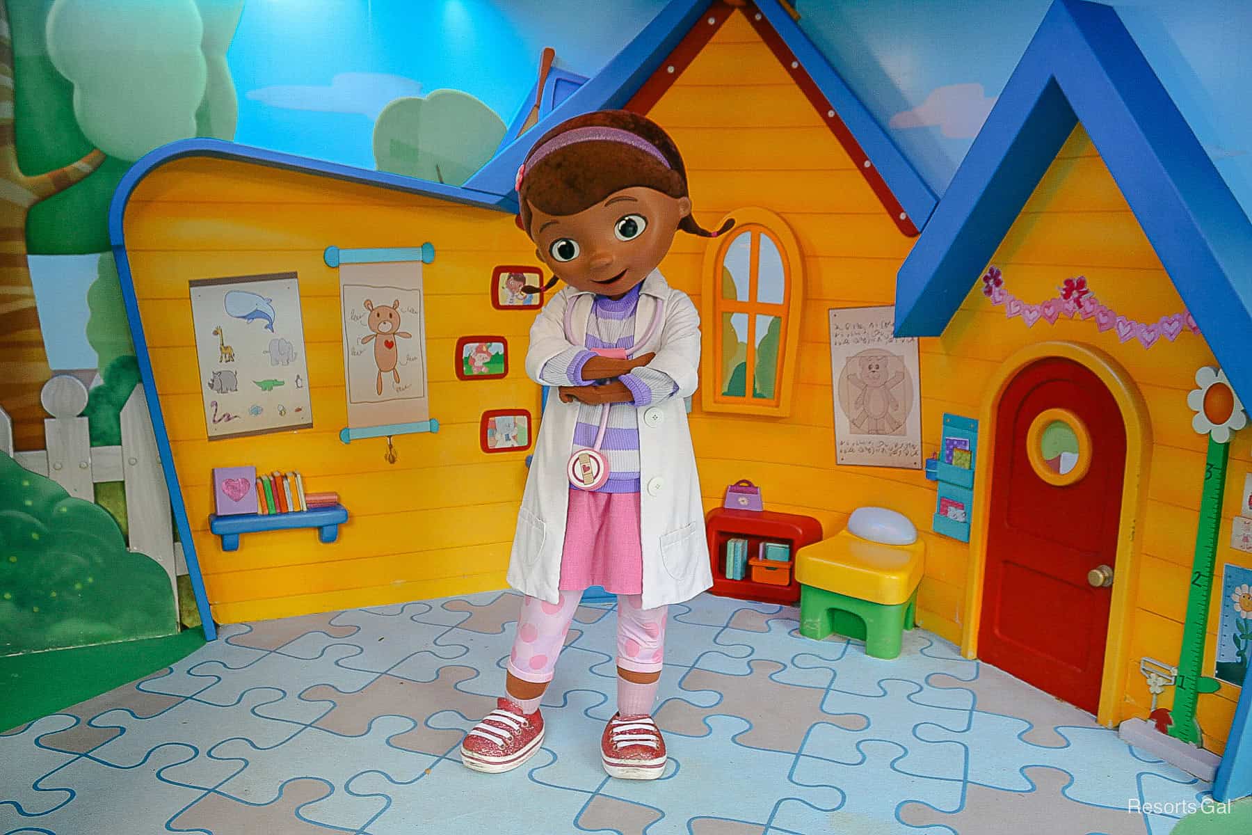 Doc McStuffins at Disney's Hollywood Studios with a veterinary clinic backdrop. 