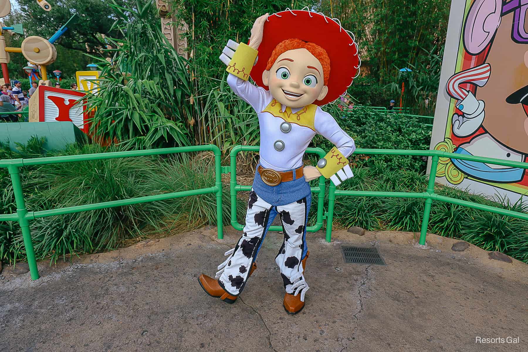 Jessie poses with hand tipping her cowgirl hat at Disney's Hollywood Studios.