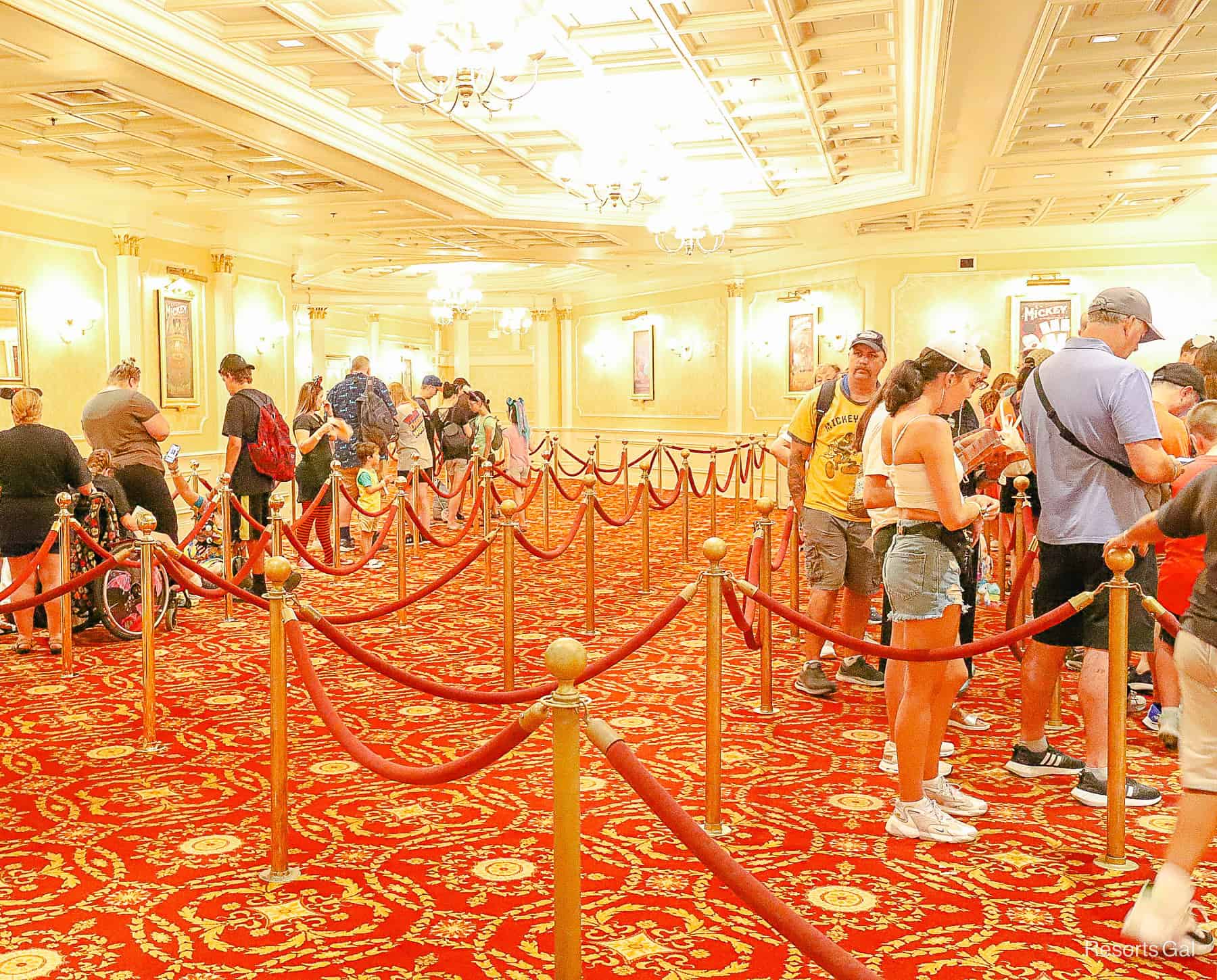 the waiting area inside Town Square theater with stanchions roping off the queue 