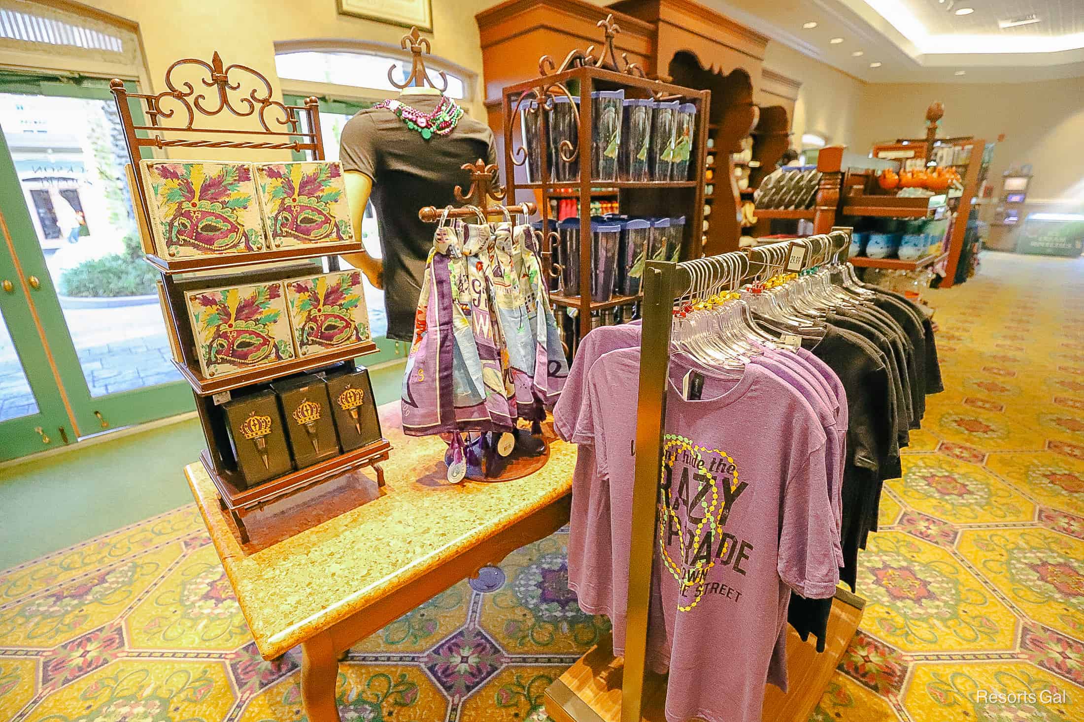 purple shirts and scarves with a masquerade print in Jackson Square Gifts and Desires 