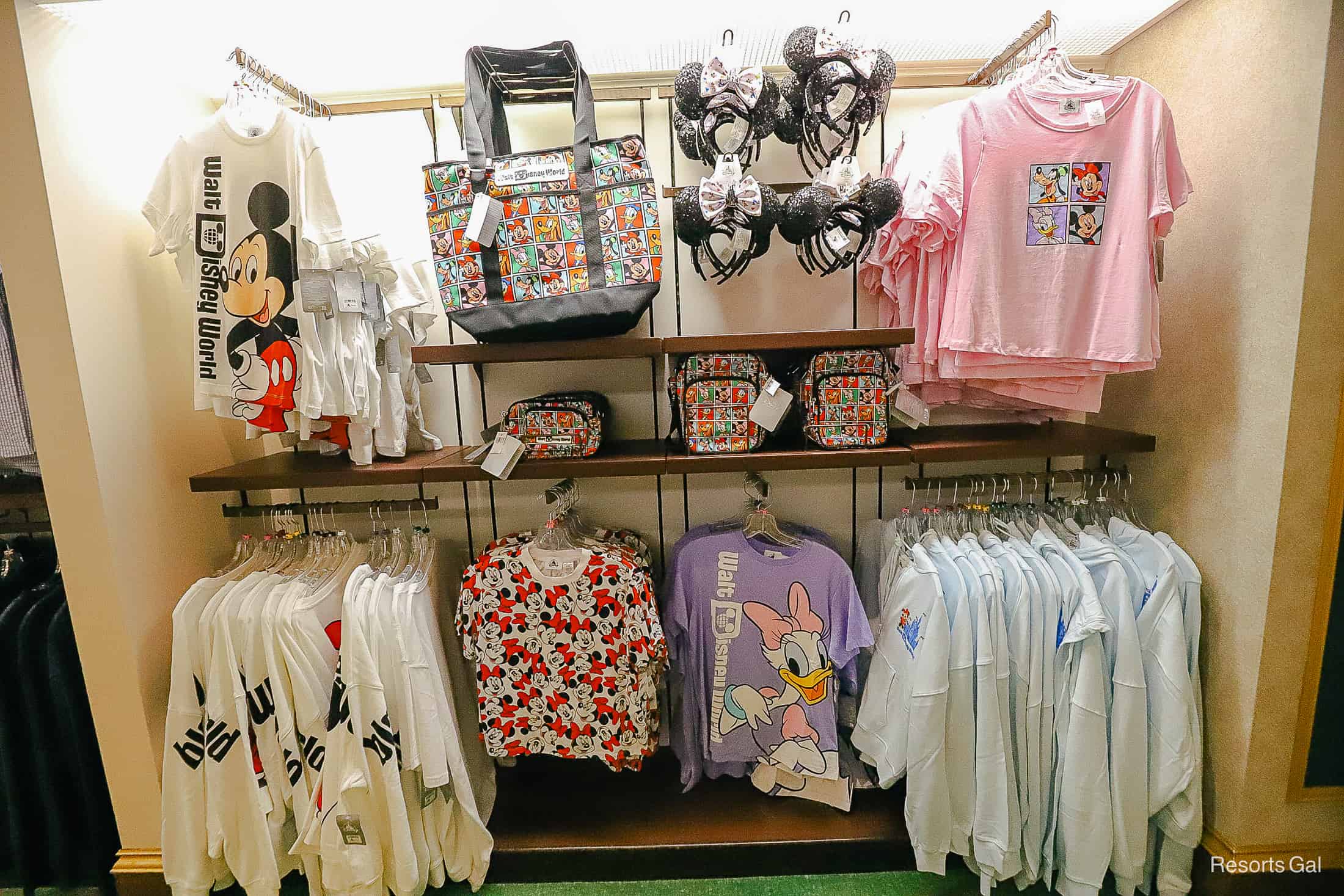 a display with shirts and other Disney items in Jackson Square Gifts and Desires 