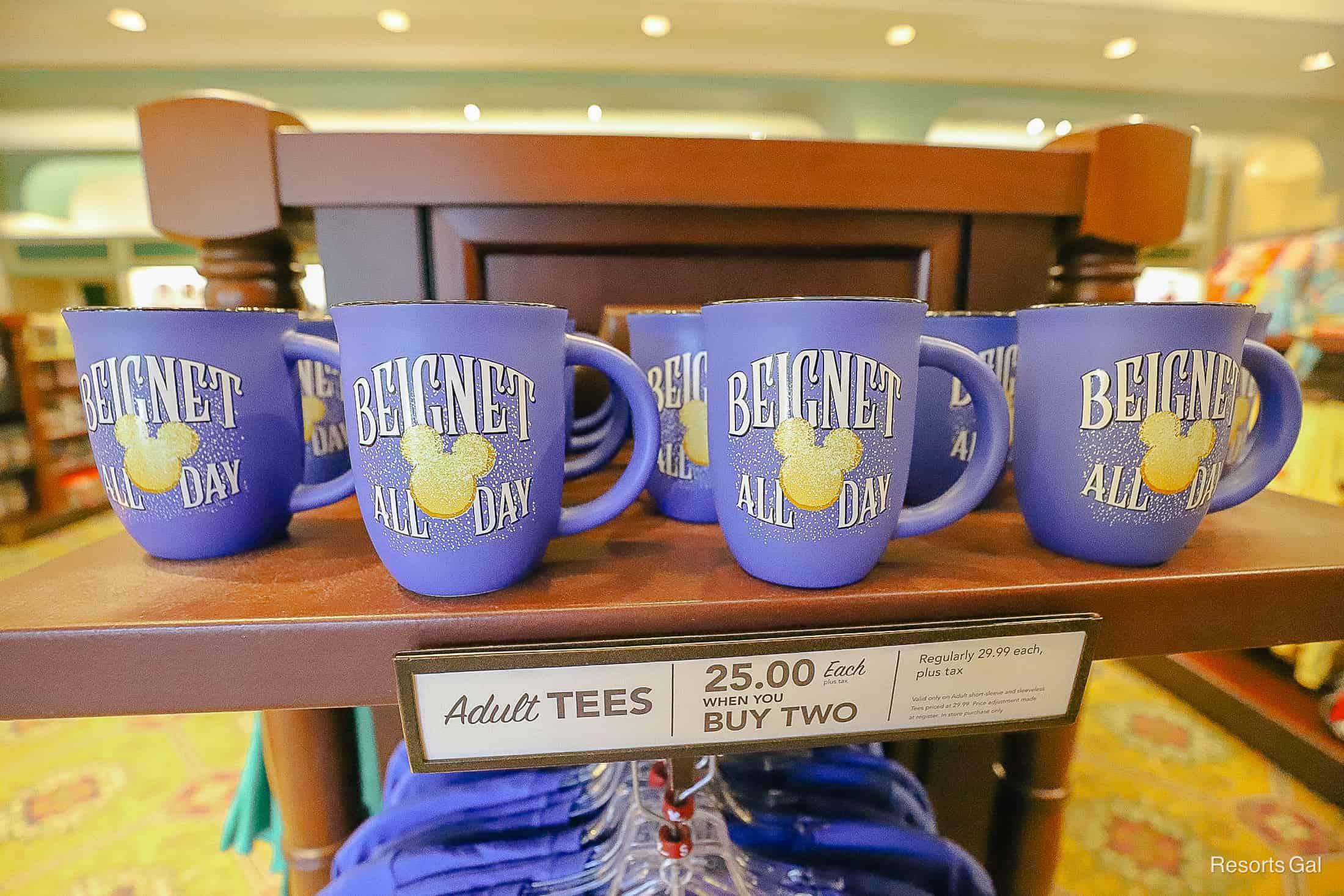 a blue beignet mug in Jackson Square Gifts and Desires at Port Orleans Riverside 