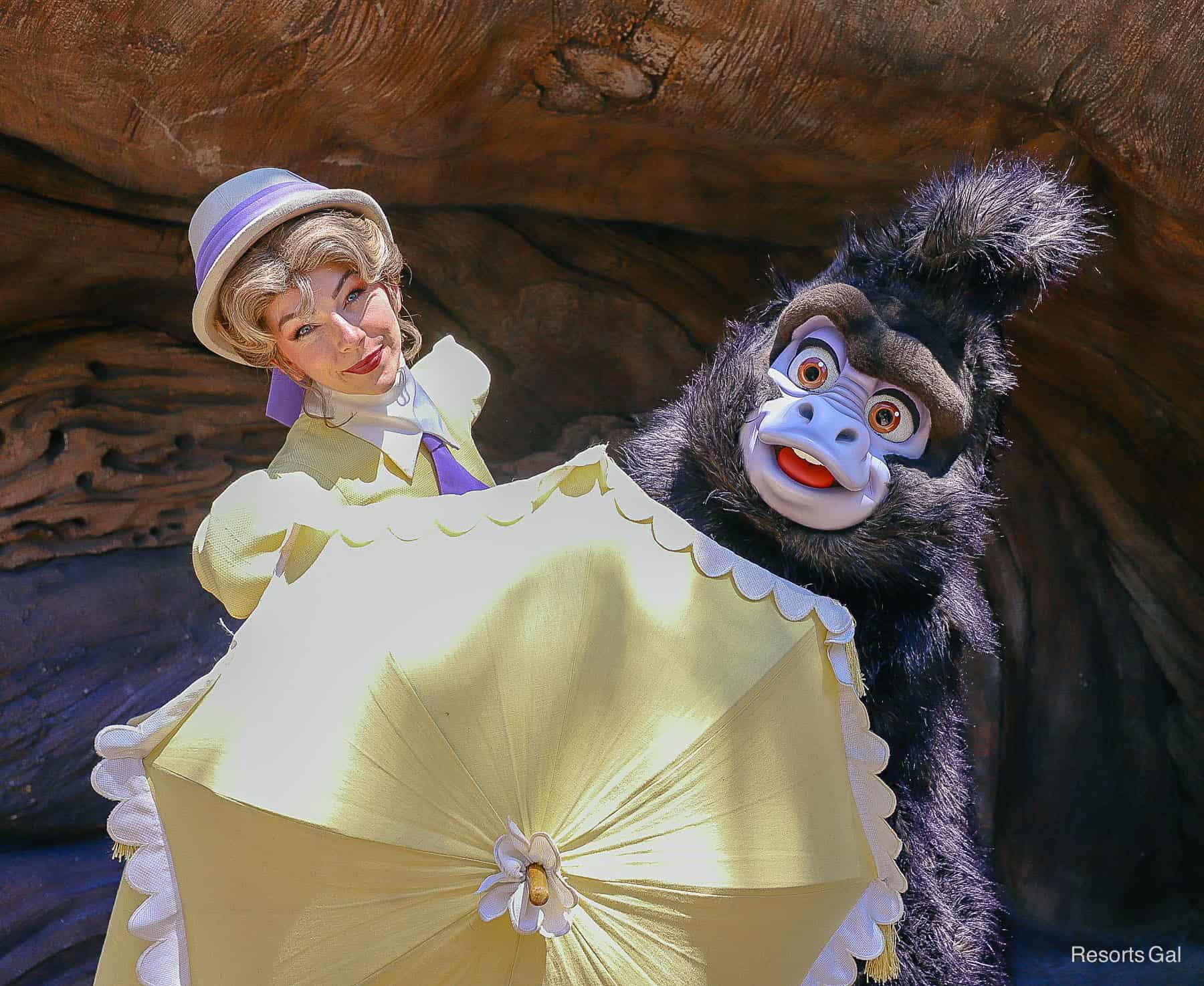 Jane and Terk pose behind Jane's yellow umbrella 