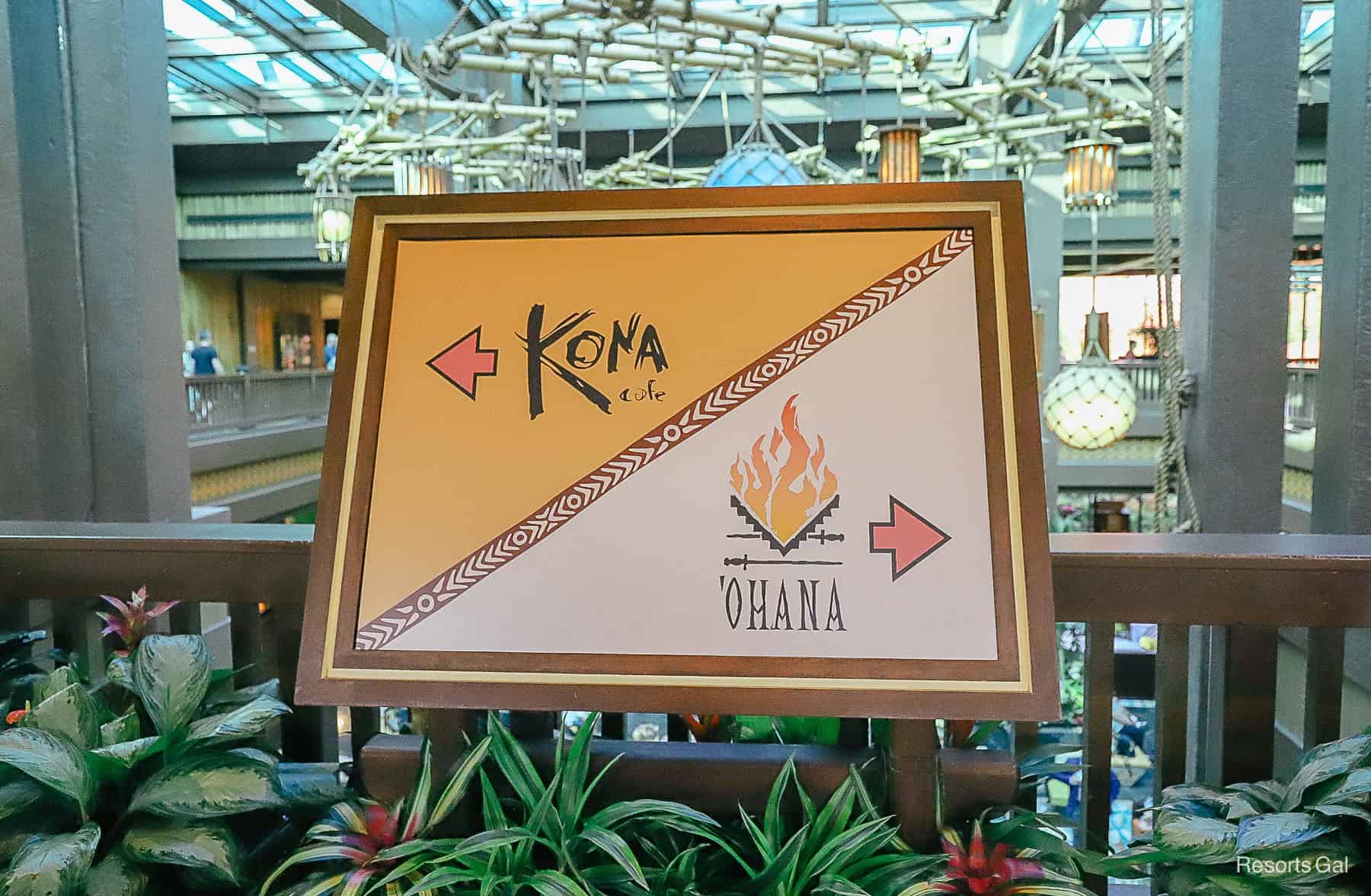 a directional that points left for Kona Cafe at the monorail exit 