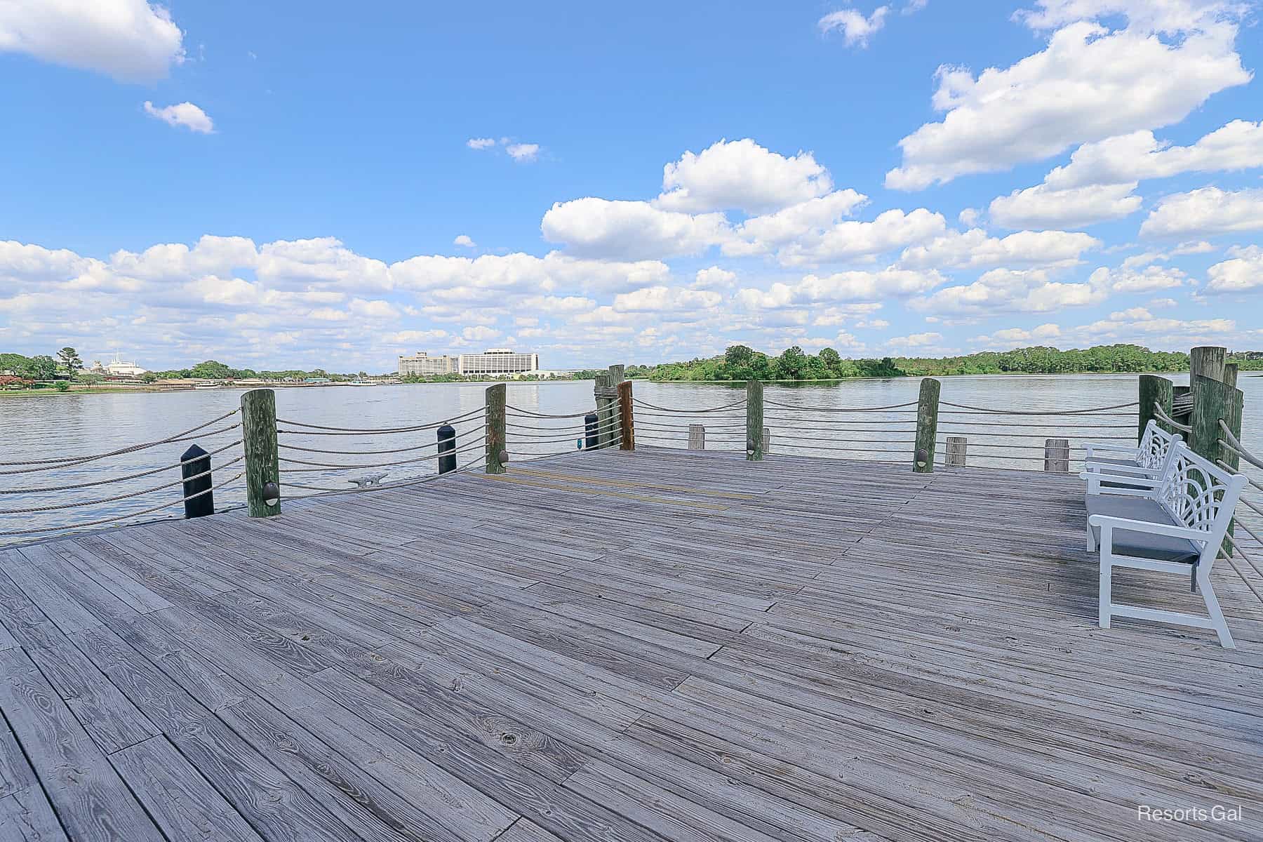 a bench where guests can sit on the boat dock 