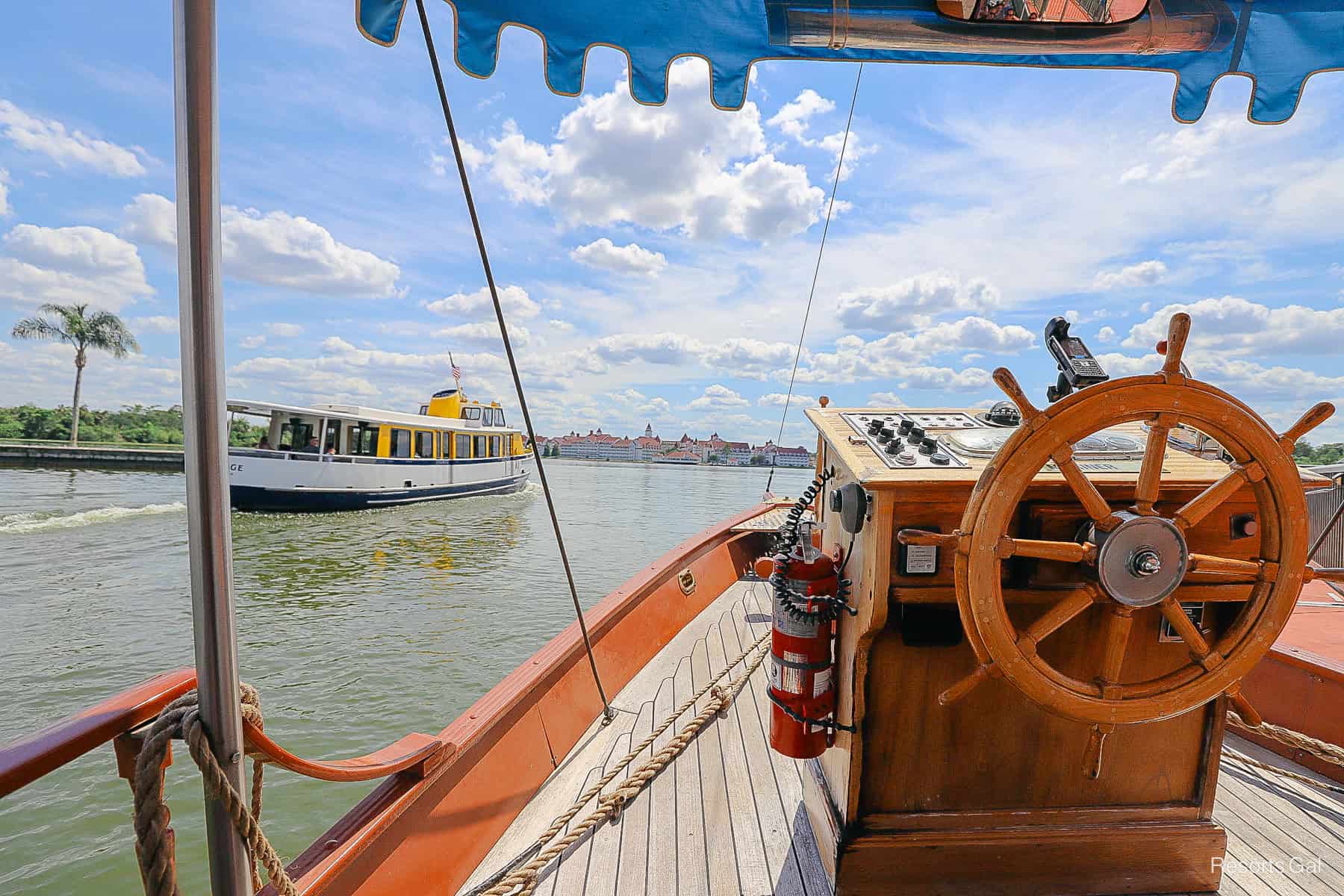 a boat docked while another boat passes