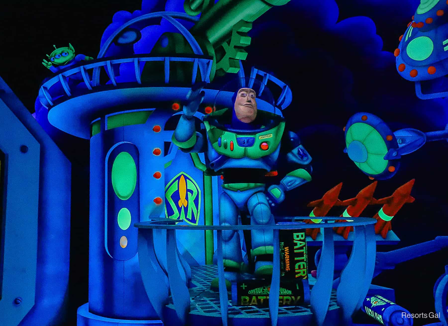 Buzz Lightyear waving to guests on Space Ranger Spin at Magic Kingdom 